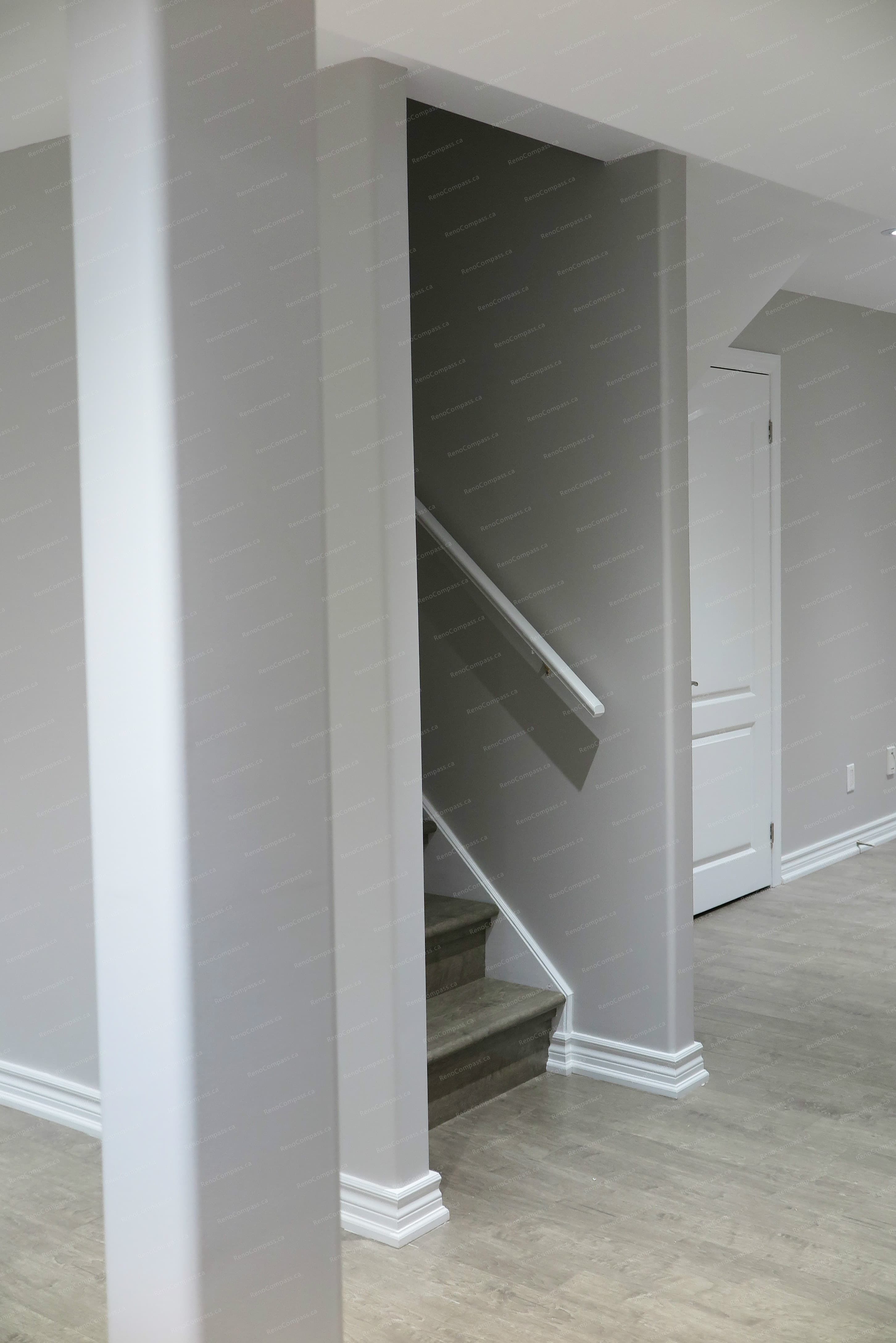 This Richmond Hill basement renovation features a neatly finished structural column that blends seamlessly into the surrounding space, maintaining visual continuity and balance.