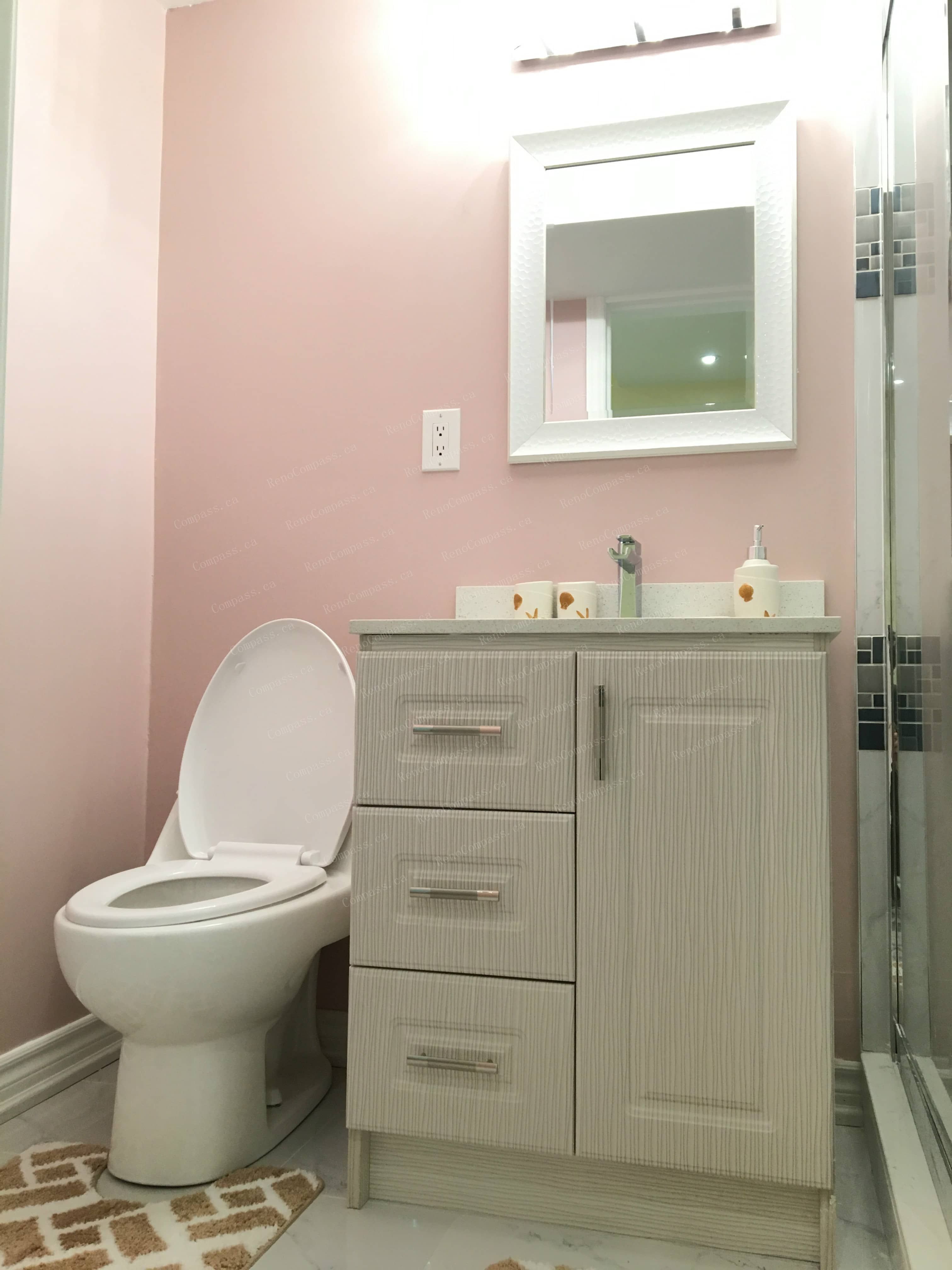 This Mississauga basement renovation features a modern bathroom vanity upgrade with ample storage, a sleek countertop, and contemporary mirror lighting. Completed by a trusted Toronto renovation company, the bathroom design enhances both functionality and visual appeal, perfectly supporting the one-bedroom, one-bathroom basement layout for comfortable everyday living.