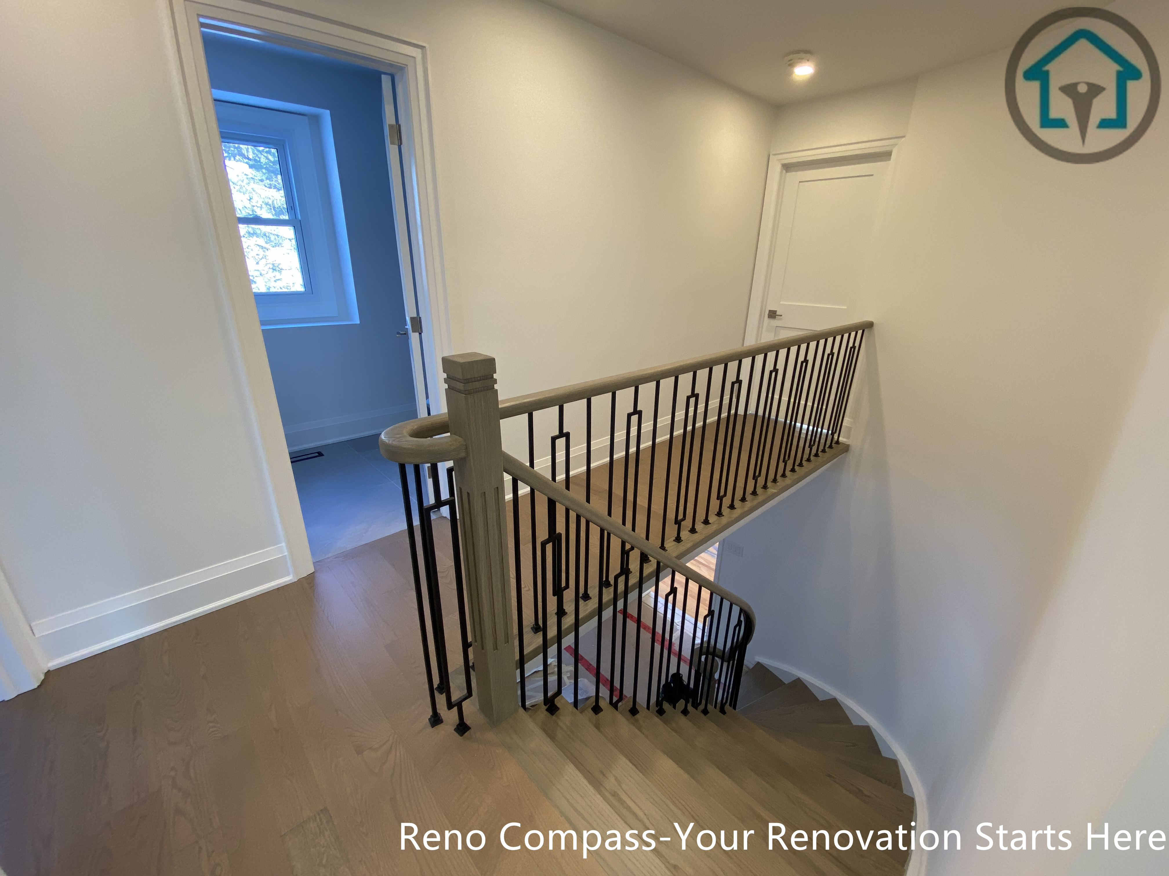 An overall view of the hardwood flooring and staircase renovation in Markham, completed by Toronto Renovation Company Reno Compass Inc. The coordinated materials and clean lines create a cohesive, modern interior suitable for long-term residential living.