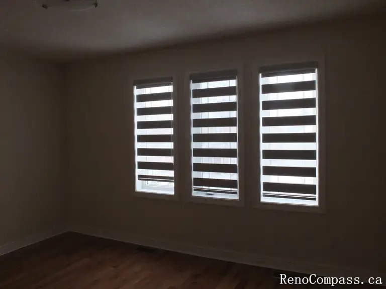 Custom zebra blinds curtains installation completed in Richmond Hill, featuring modern dual-layer window shades that provide privacy, light control, and a clean contemporary look. This professional window treatment upgrade enhances interior comfort and style, perfectly suited for modern home renovations by a trusted Toronto renovation company.