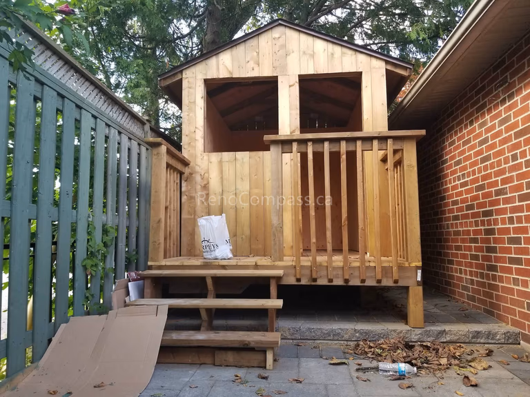 This Toronto landscaping renovation project includes a custom-built wooden garden shed designed for durability and practical outdoor storage. Featuring natural wood framing, elevated decking, and secure railing details, the structure complements the surrounding hardscape and backyard layout. Installed on a stable interlocking stone base, this professionally constructed outdoor shed enhances functionality while maintaining a cohesive and attractive backyard design.