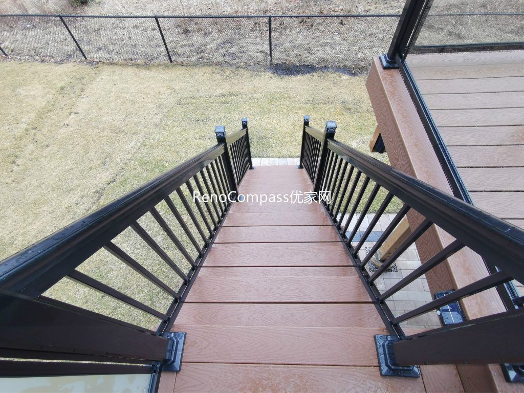 Professional deck construction project in Aurora featuring durable composite wood decking, modern black aluminum and glass railings, and a spacious outdoor layout. Designed for long-term durability and low maintenance, this backyard deck enhances outdoor comfort, safety, and property value.
