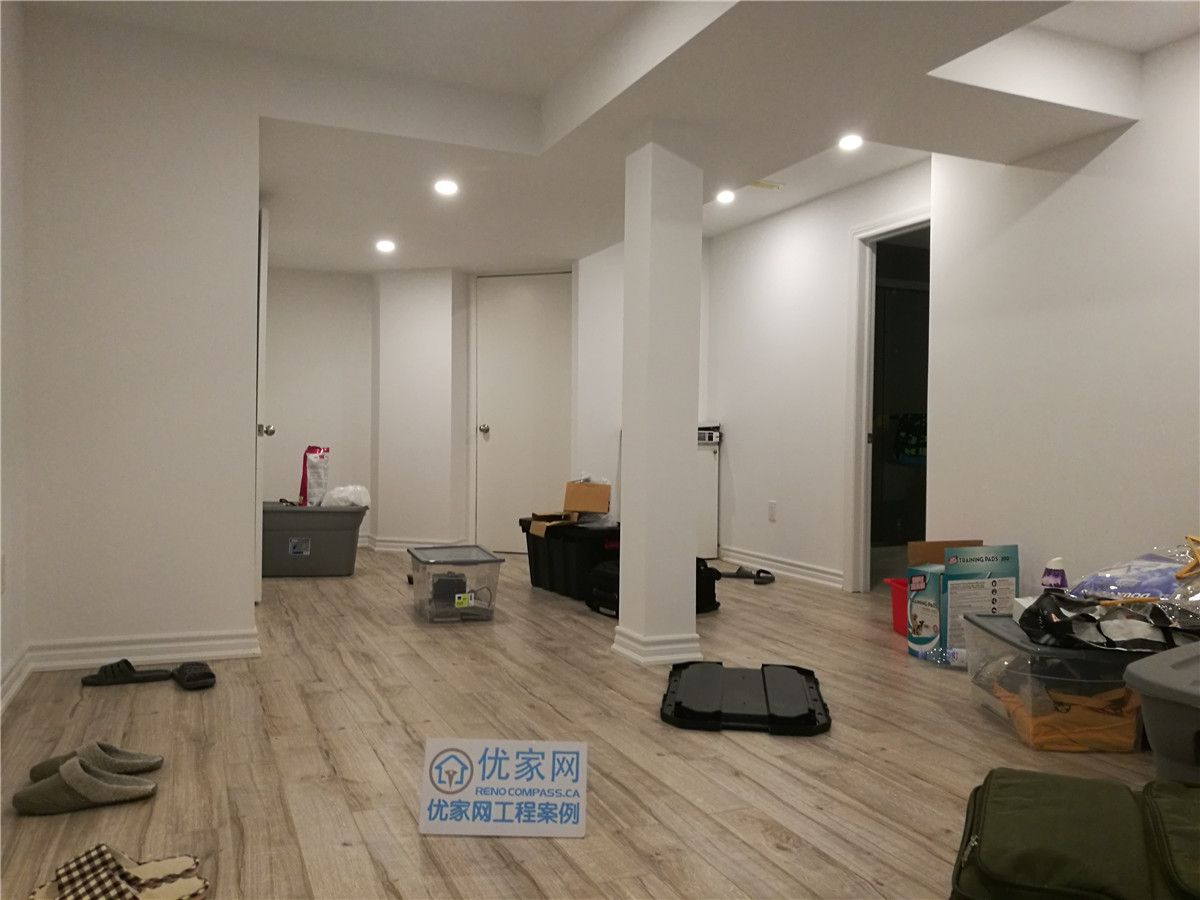Finished basement interior renovation in Richmond Hill featuring open-concept layout, upgraded flooring, smooth ceiling with recessed pot lights, and structural columns seamlessly integrated into the space. Completed by a professional Toronto renovation company, this basement renovation improves functionality, brightness, and overall livability.