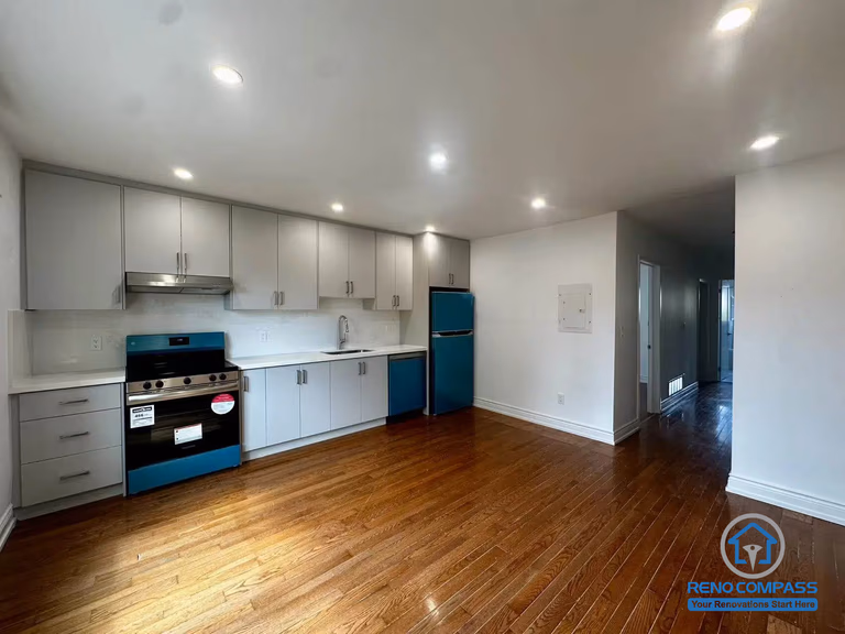 This main floor unit features an open-concept kitchen and spacious living area with hardwood flooring and modern finishes. As part of a Toronto legal 3-unit conversion, the layout is designed for comfortable independent living and strong rental appeal.
