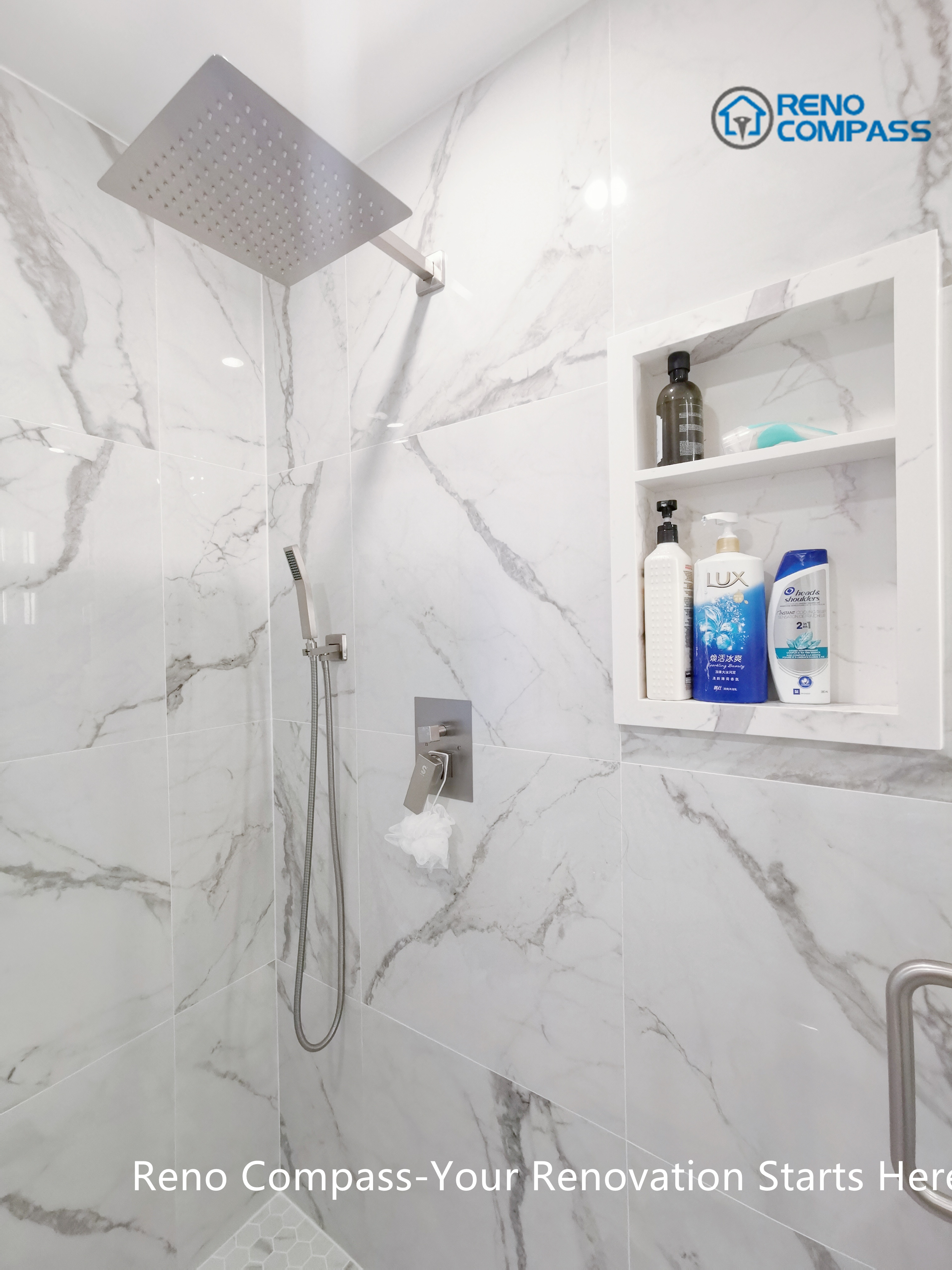 This Mississauga bathroom renovation highlights a frameless walk-in shower finished with large-format marble-look porcelain tiles. A ceiling-mounted rain shower head, handheld fixture, and built-in wall niche improve everyday comfort while maintaining a clean, minimalist appearance. The recessed storage niche enhances functionality without interrupting the visual flow of the space. Precision tile installation and thoughtful detailing reflect the quality standards expected from a professional Toronto renovation company.
