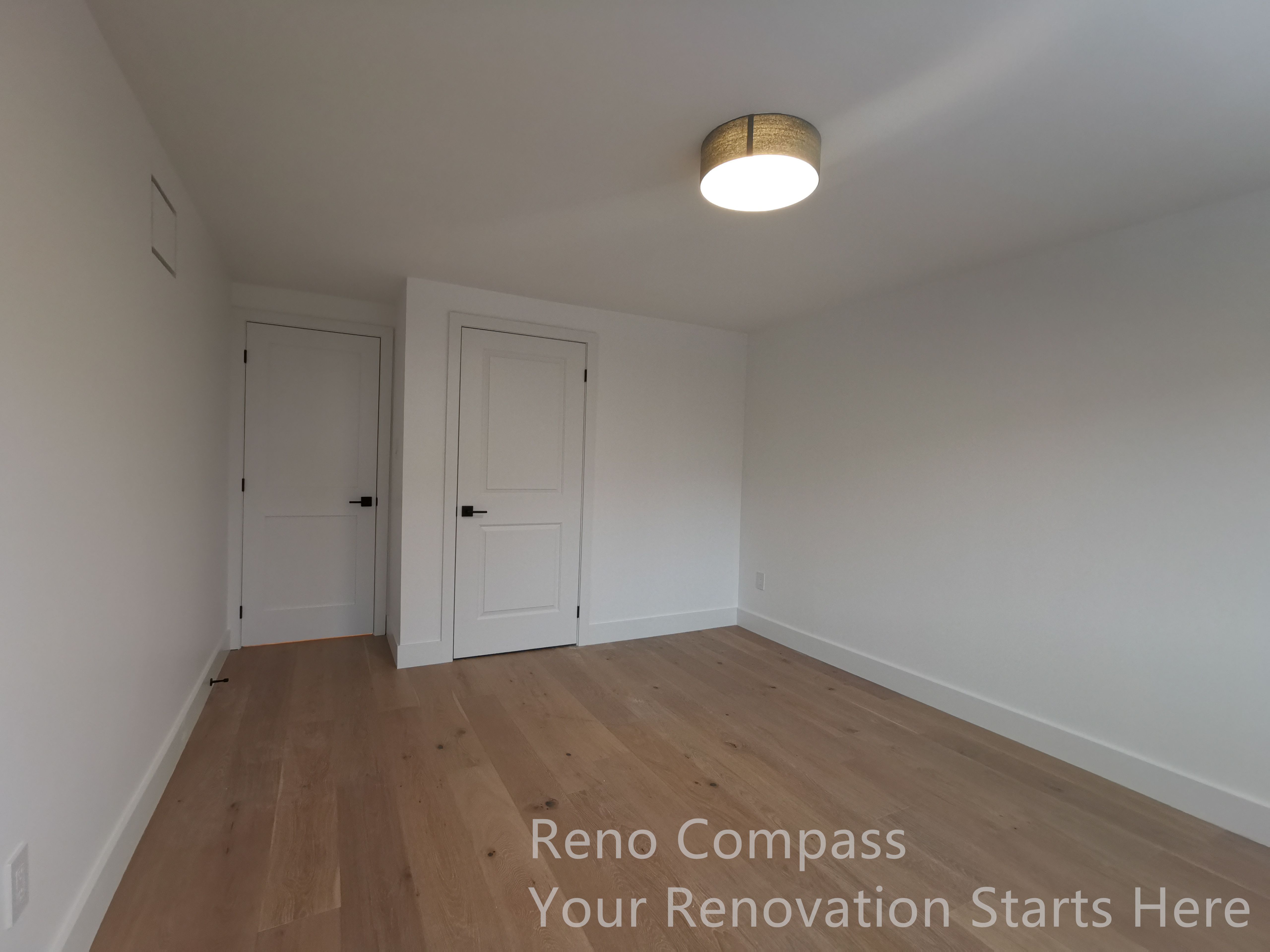 This custom wood staircase features clean lines, solid wood treads, and a glass railing system that enhances light flow while maintaining safety. The design creates a seamless transition between levels and adds a modern architectural focal point to the interior.