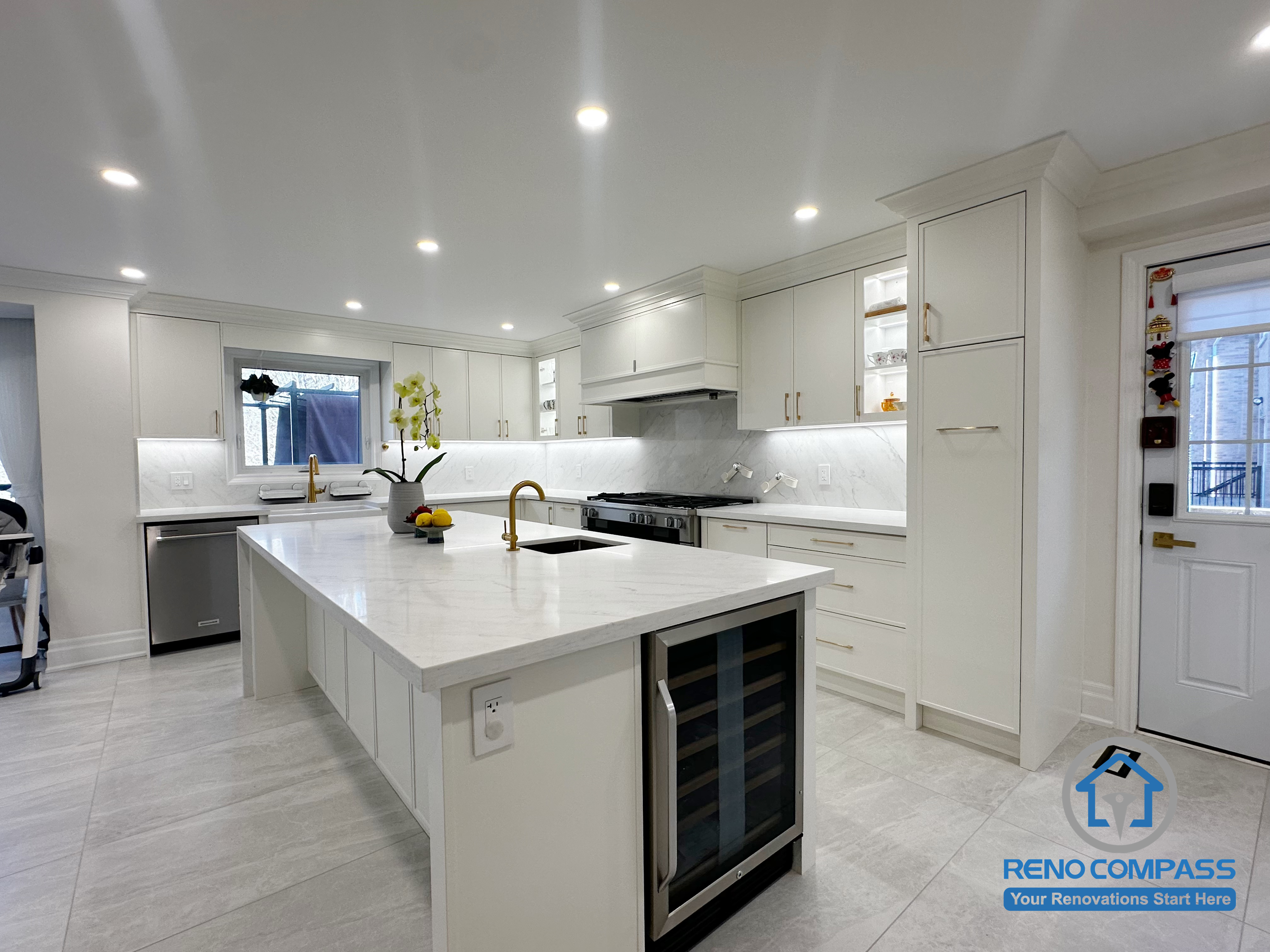 This Markham kitchen renovation features a centrally positioned island that anchors the space and enhances daily functionality. Custom white cabinetry, quartz countertops, and integrated storage solutions create a clean, organized layout, while recessed lighting ensures consistent brightness throughout. The design balances openness, efficiency, and modern elegance, making the kitchen well suited for both everyday use and entertaining.