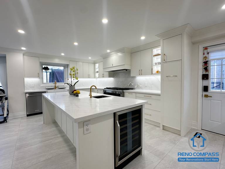 This Markham kitchen renovation features a centrally positioned island that anchors the space and enhances daily functionality. Custom white cabinetry, quartz countertops, and integrated storage solutions create a clean, organized layout, while recessed lighting ensures consistent brightness throughout. The design balances openness, efficiency, and modern elegance, making the kitchen well suited for both everyday use and entertaining.