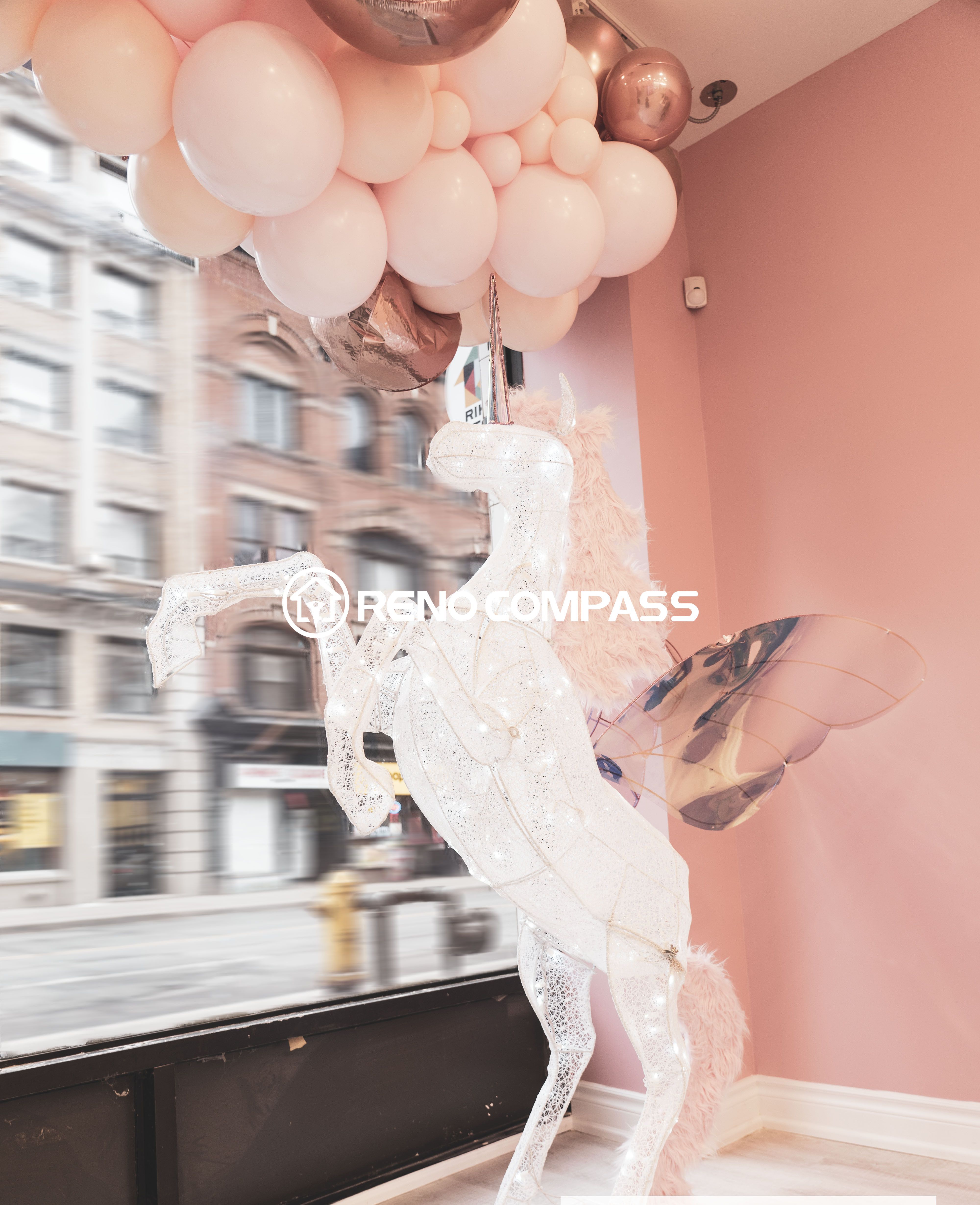 This Toronto beauty store commercial renovation features a charming window display area designed with soft pink tones, decorative balloons, and a unique winged horse sculpture. The stylish retail interior creates a visually striking storefront that attracts customers and enhances the brand’s aesthetic identity. Completed by a professional Toronto renovation company, the design combines creative decoration with modern retail presentation to elevate the shopping atmosphere.