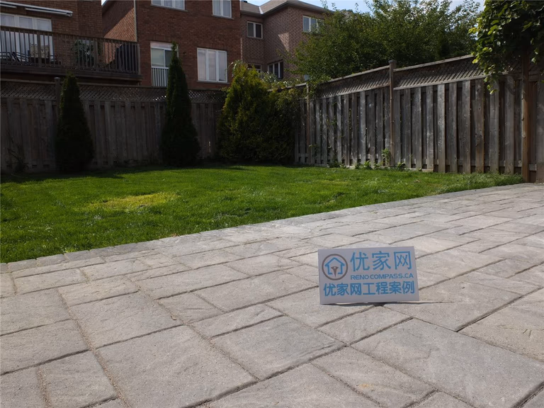 This image showcases a completed backyard interlock patio landscaping project in Markham. High-quality interlocking pavers were professionally installed to create a clean, durable outdoor patio area that integrates seamlessly with the lawn, enhancing both functionality and curb appeal for residential outdoor spaces.