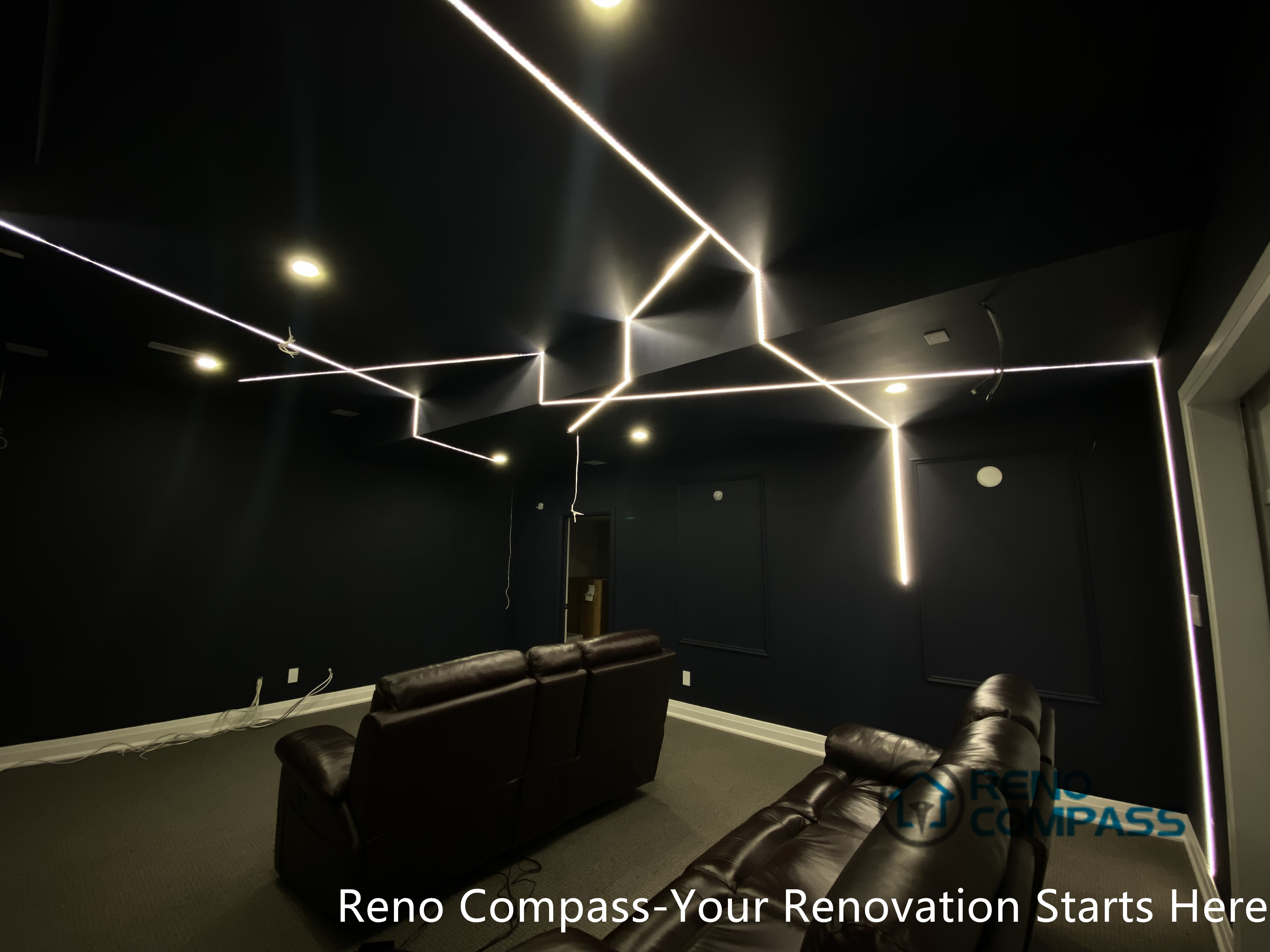 This Newmarket basement home theater renovation features a modern dark-tone design with custom recessed LED ceiling lighting, acoustic wall panels, and a dedicated media seating layout. Designed and built by an experienced Toronto renovation company, this basement transformation delivers a cinematic atmosphere while maintaining comfort, clean lines, and functional lighting control—ideal for family entertainment and private movie nights.