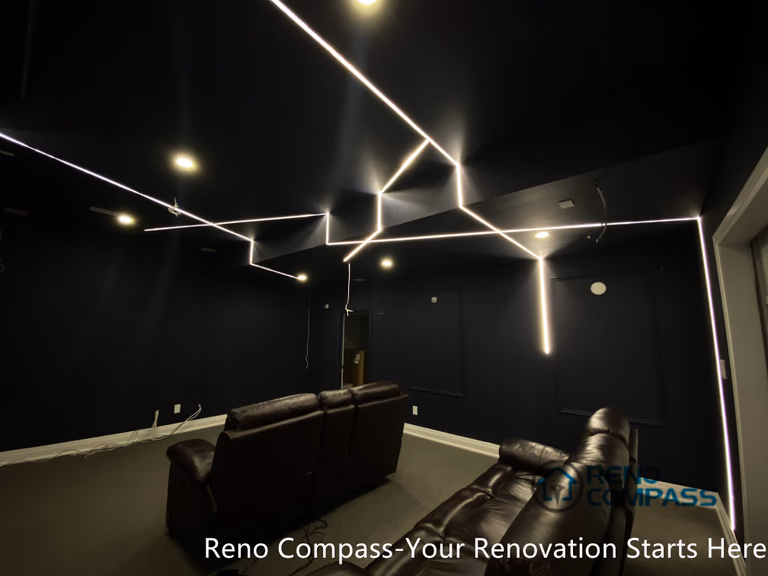 This Newmarket basement home theater renovation features a modern dark-tone design with custom recessed LED ceiling lighting, acoustic wall panels, and a dedicated media seating layout. Designed and built by an experienced Toronto renovation company, this basement transformation delivers a cinematic atmosphere while maintaining comfort, clean lines, and functional lighting control—ideal for family entertainment and private movie nights.