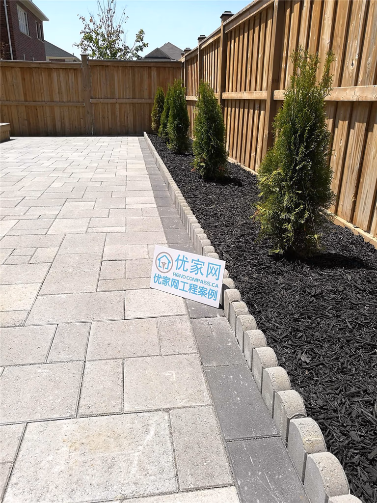 This image captures an outdoor walkway constructed during a Stouffville landscaping renovation project. The combination of stepping stones, gravel, and structured layout improves both functionality and visual continuity across the property. The renovation delivers a durable, low-maintenance solution suitable for modern residential landscaping.