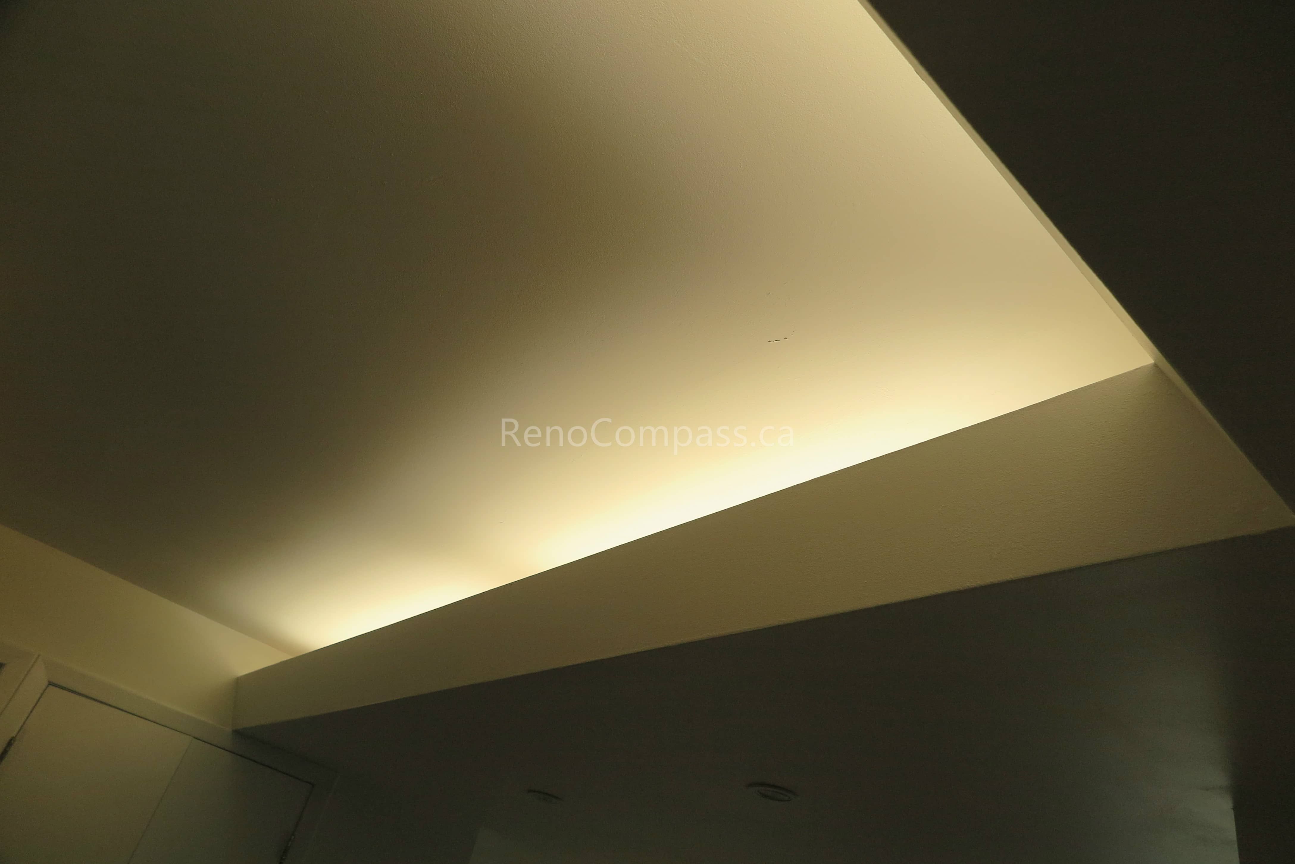 Custom LED cove lighting installed during this Scarborough basement renovation enhances the ceiling design with soft ambient illumination and a modern aesthetic. The upgraded lighting layout adds warmth, depth, and a premium finish to the newly renovated basement living space. Completed by Reno Compass Inc., a trusted Toronto renovation company specializing in basement renovations and interior upgrades.