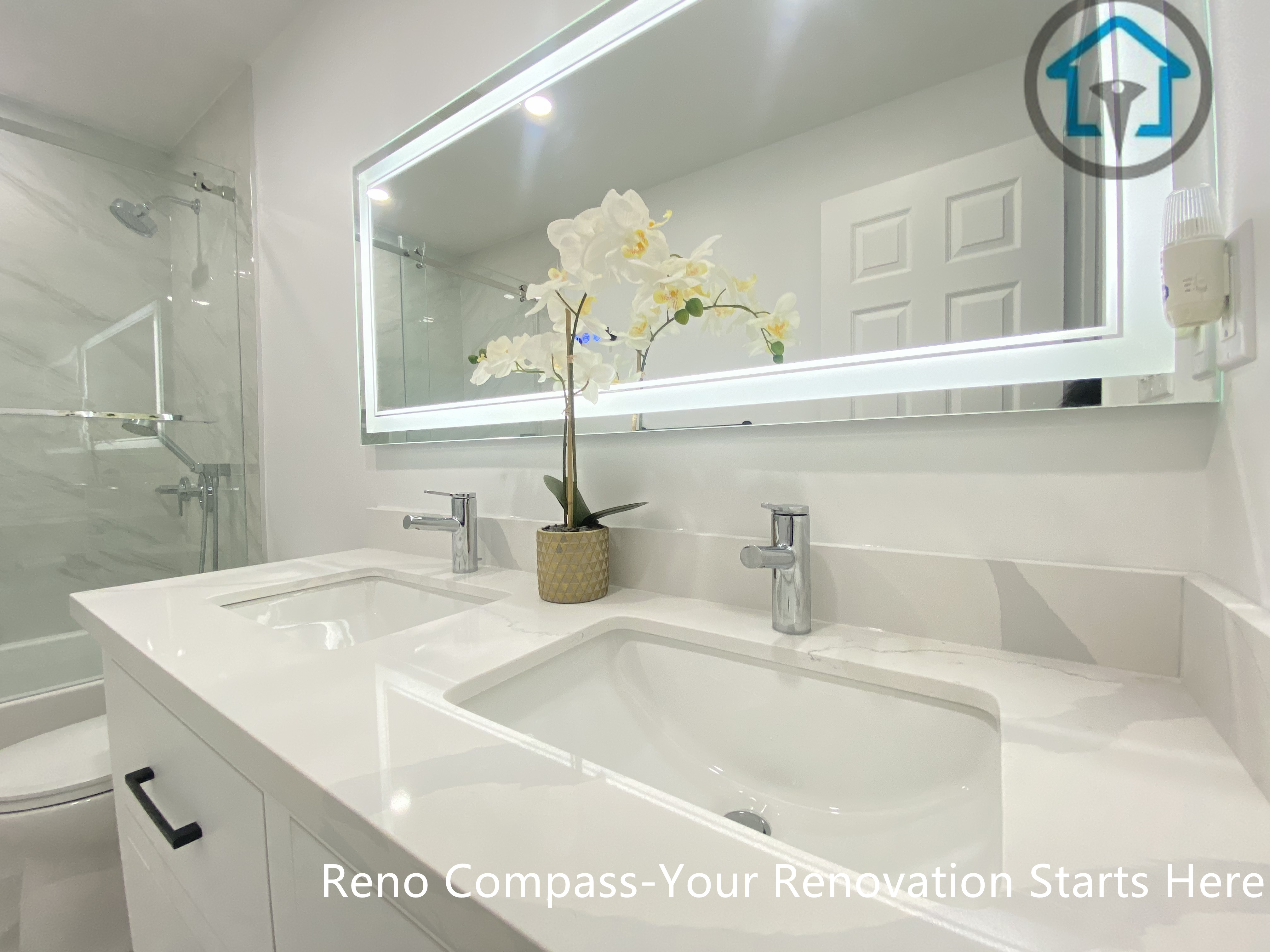 This Pickering bathroom renovation features a clean, modern double-sink vanity designed for everyday convenience and visual balance. The seamless white countertop, integrated rectangular sinks, and minimalist chrome faucets create a calm and refined look. A full-width LED mirror enhances lighting and depth, improving both functionality and the overall bathroom experience.