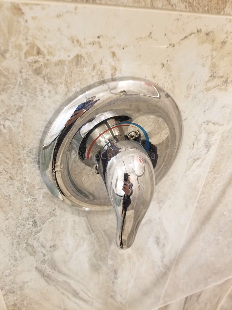 As part of this Markham bathroom renovation, a modern shower faucet and temperature control valve were professionally installed to enhance functionality and user comfort. The upgraded fixture complements the new wall tiles and shower system, offering smooth water control, improved durability, and a clean contemporary finish that elevates the overall bathroom design.
