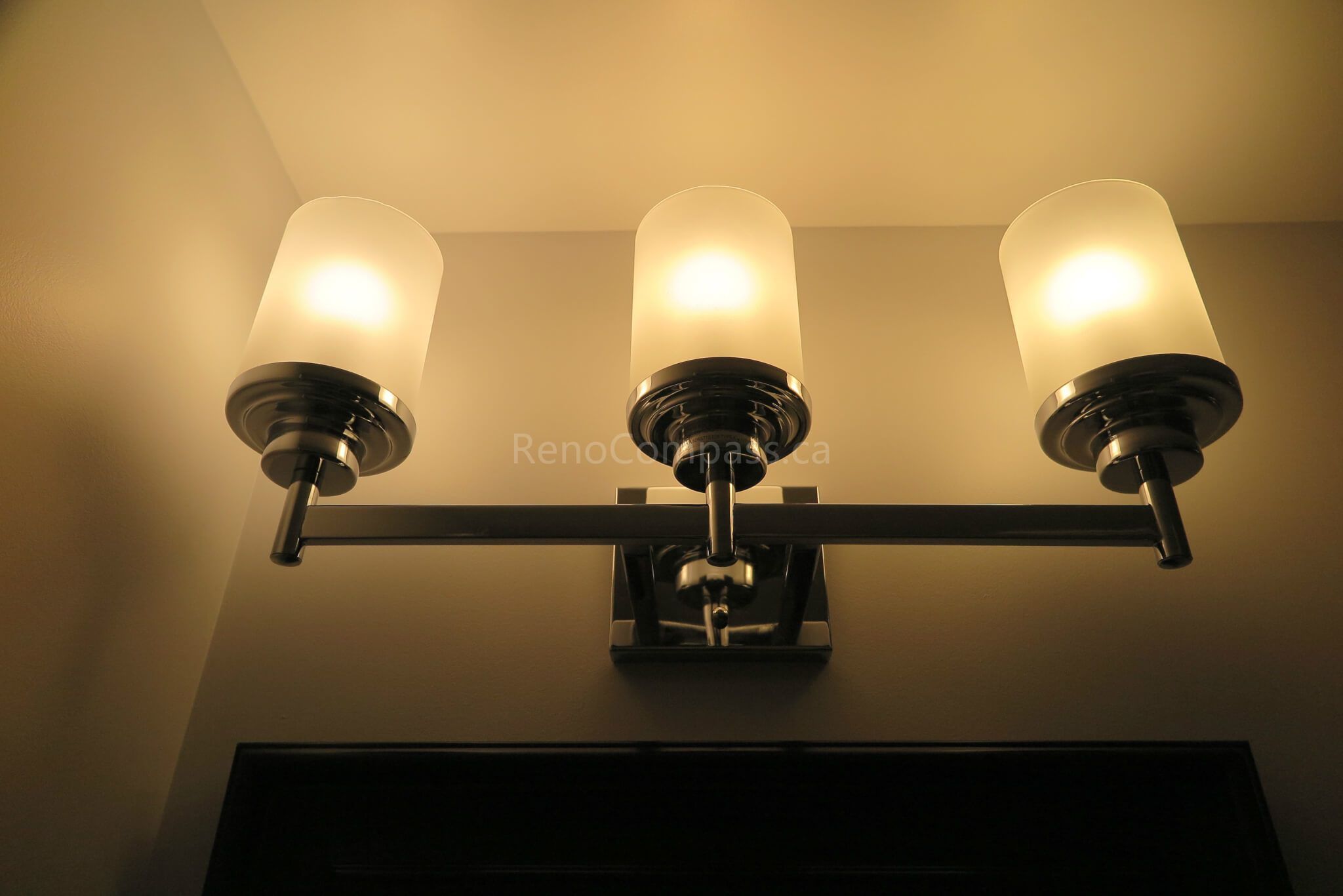 Warm ambient lighting and updated vanity space in the Richmond Hill basement renovation, creating a cozy and inviting bathroom environment.