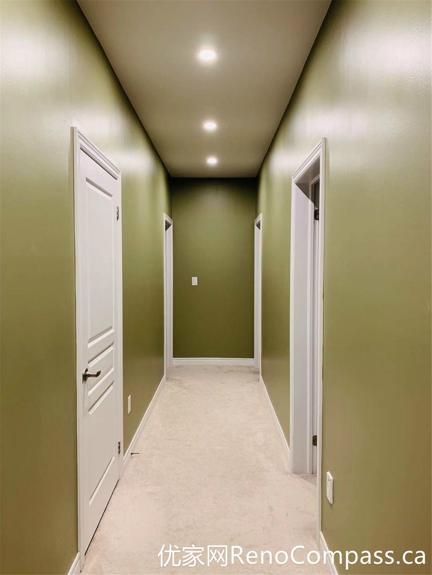 This hallway from a Markham full home renovation features soft green walls, clean white trim, and a simple, functional layout. Natural light enhances the depth of the space, while the updated finishes create a cohesive transition between rooms with a calm and modern feel.