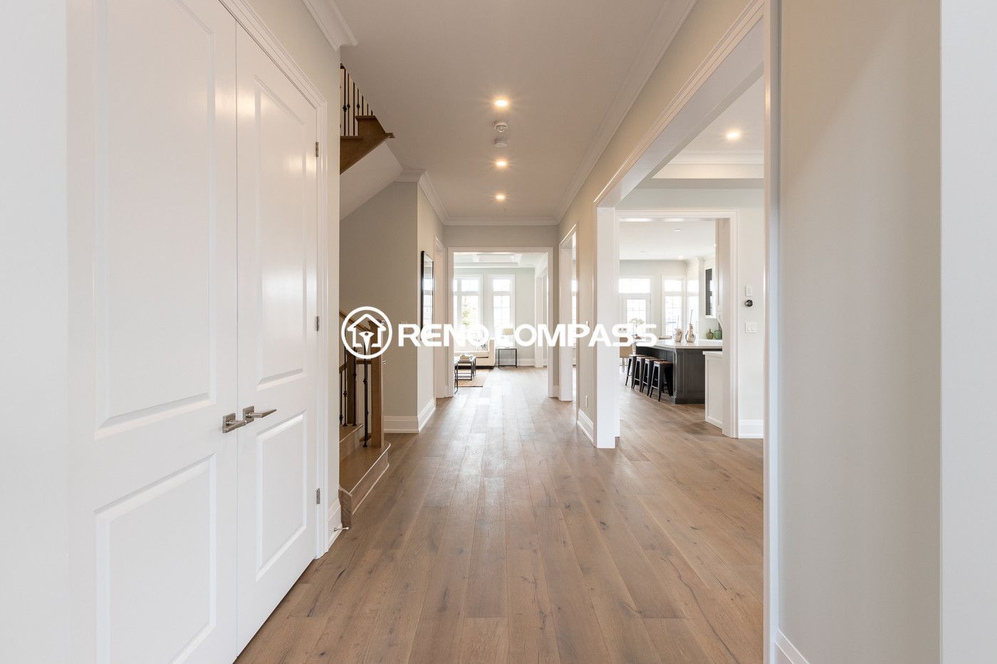 This image shows part of a Newmarket home flooring renovation project in the Toronto area, featuring professionally installed engineered wood flooring. Engineered flooring is constructed with multiple cross-layered wood boards, offering better stability and resistance to moisture compared to traditional solid hardwood while maintaining the same natural appearance and comfortable feel.