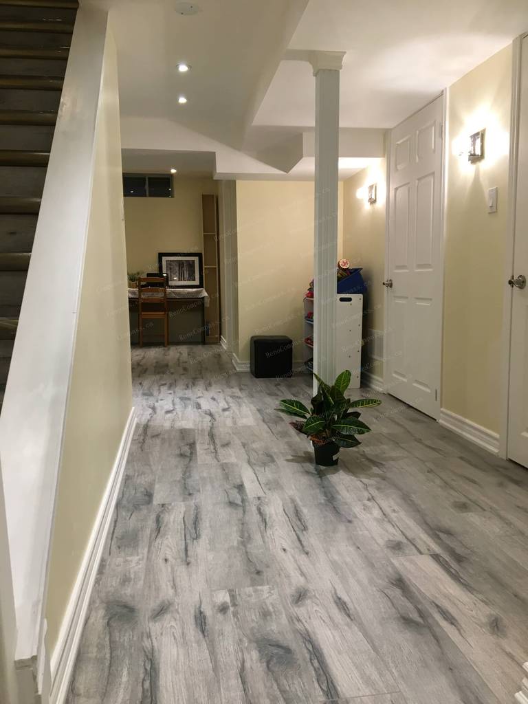 This Mississauga basement renovation showcases a newly upgraded hallway with durable modern flooring, recessed ceiling lights, and clean neutral finishes. Completed by a trusted Toronto renovation company, the refreshed basement layout improves flow, brightness, and functionality, creating a comfortable living environment ideal for a one-bedroom basement suite with bathroom.