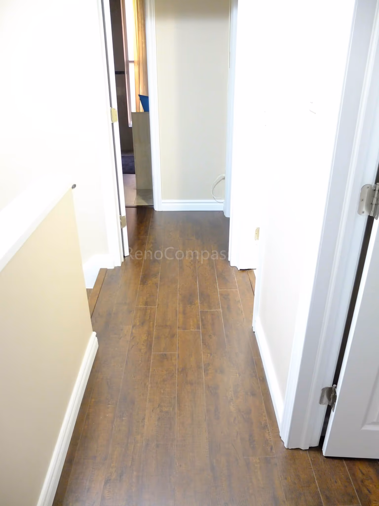 This North York interior renovation features upgraded wood flooring and a modern staircase design that enhances both safety and visual appeal. Completed by a professional Toronto renovation company, the project focuses on durable materials, clean finishing details, and a cohesive layout to create a warm and modern living space.