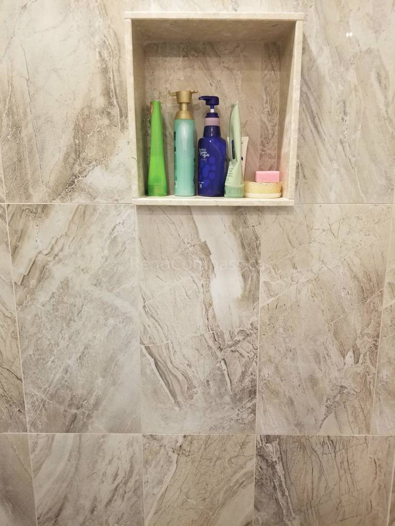 This Markham bathroom renovation features newly installed shower wall tiles with a built-in recessed niche for convenient storage. The modern tile design enhances both functionality and visual appeal, providing a clean, elegant finish that is easy to maintain. As part of a full bathroom upgrade including new flooring, shower, and vanity, the space now offers improved comfort, durability, and a contemporary look for everyday use.