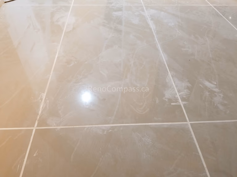 This Mississauga interior renovation features elegant large-format tile flooring with a polished finish that enhances brightness and creates a clean, modern look. The neutral-toned tiles provide durability, easy maintenance, and a timeless aesthetic suitable for kitchens, bathrooms, and main living areas.

Installed by Reno Compass Inc., this professional tile flooring upgrade delivers precision craftsmanship and a high-end finish that elevates both functionality and property value.