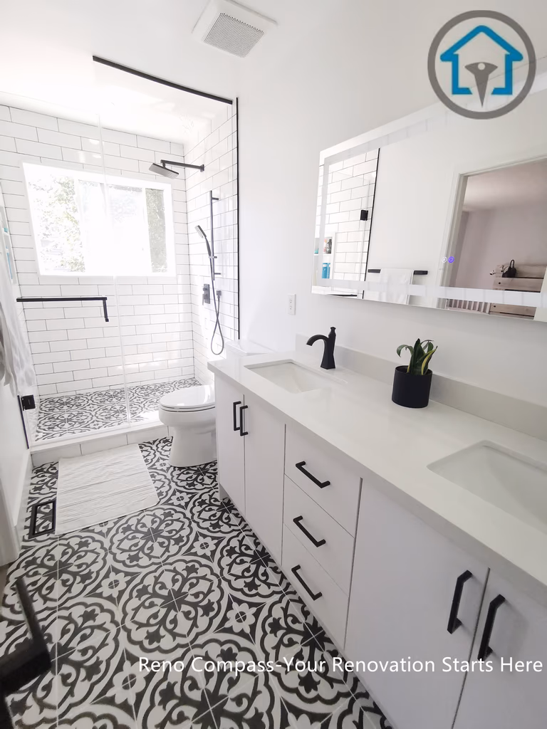 This Ajax bathroom renovation showcases a bright, modern layout featuring a white vanity, matte black hardware, and a frameless glass shower. The bold patterned floor tiles add visual depth while maintaining a clean, cohesive look, creating a bathroom that balances style, comfort, and everyday functionality.