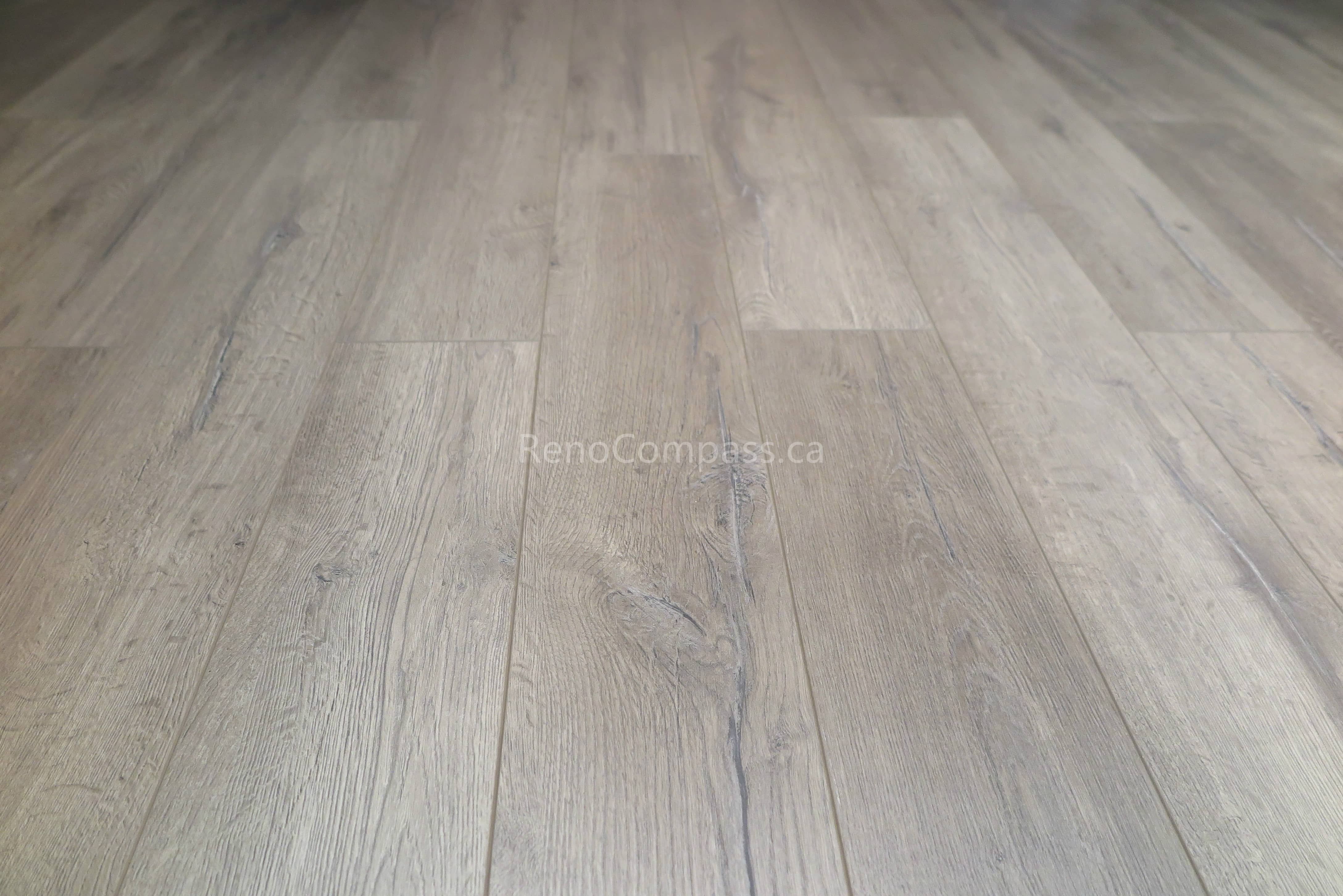 New waterproof vinyl flooring installed during a Scarborough basement renovation, featuring durable wood-look planks designed for comfort and long-term performance. The modern flooring enhances the basement’s warmth, functionality, and easy maintenance, making it ideal for family living and multi-use spaces. Completed by Reno Compass Inc., a trusted Toronto renovation company specializing in basement and full interior renovations.