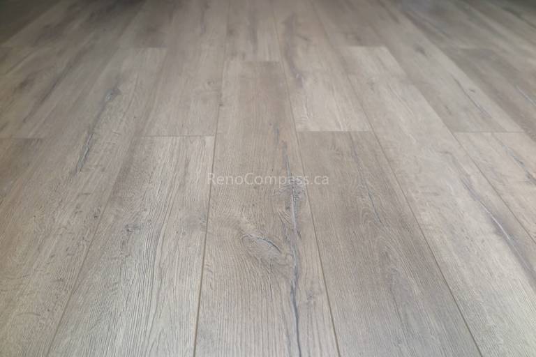 New waterproof vinyl flooring installed during a Scarborough basement renovation, featuring durable wood-look planks designed for comfort and long-term performance. The modern flooring enhances the basement’s warmth, functionality, and easy maintenance, making it ideal for family living and multi-use spaces. Completed by Reno Compass Inc., a trusted Toronto renovation company specializing in basement and full interior renovations.