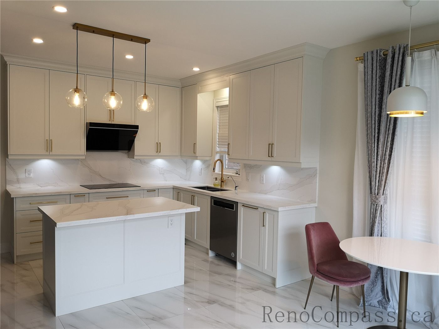 This Aurora kitchen renovation showcases a bright open-concept design featuring custom white shaker cabinets, quartz countertops, and a functional center island. Elegant pendant lighting, marble-style flooring, and brushed gold fixtures add warmth and sophistication to the modern space. Completed by a professional Toronto renovation company focused on quality craftsmanship, efficient layout planning, and timeless interior design.