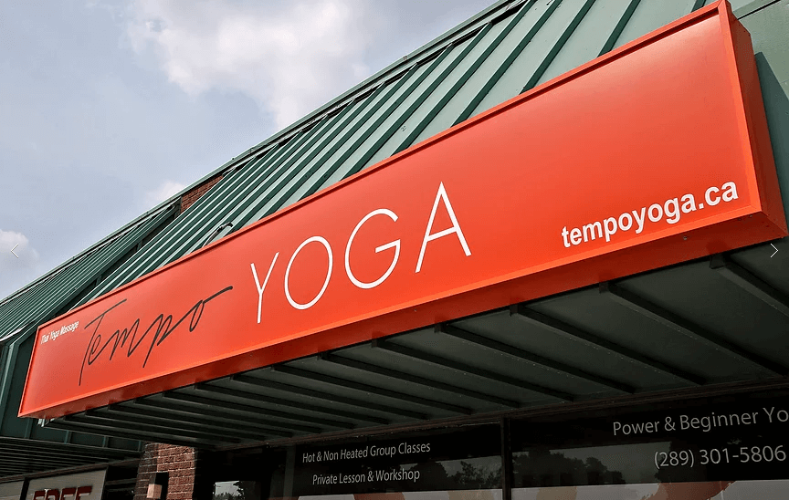This Richmond Hill yoga studio renovation project features a modern storefront upgrade completed by Reno Compass. The custom bright orange illuminated sign with clean typography and integrated website branding enhances street visibility and strengthens the studio’s professional image. The exterior improvement focuses on strong brand presence, durability, and a welcoming commercial façade, ideal for yoga studios, wellness centers, and retail businesses. As a trusted Toronto renovation company, Reno Compass provides complete commercial renovation solutions from design to installation, helping businesses elevate their storefront appeal and customer experience.