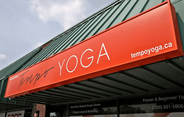 This Richmond Hill yoga studio renovation project features a modern storefront upgrade completed by Reno Compass. The custom bright orange illuminated sign with clean typography and integrated website branding enhances street visibility and strengthens the studio’s professional image. The exterior improvement focuses on strong brand presence, durability, and a welcoming commercial façade, ideal for yoga studios, wellness centers, and retail businesses. As a trusted Toronto renovation company, Reno Compass provides complete commercial renovation solutions from design to installation, helping businesses elevate their storefront appeal and customer experience.
