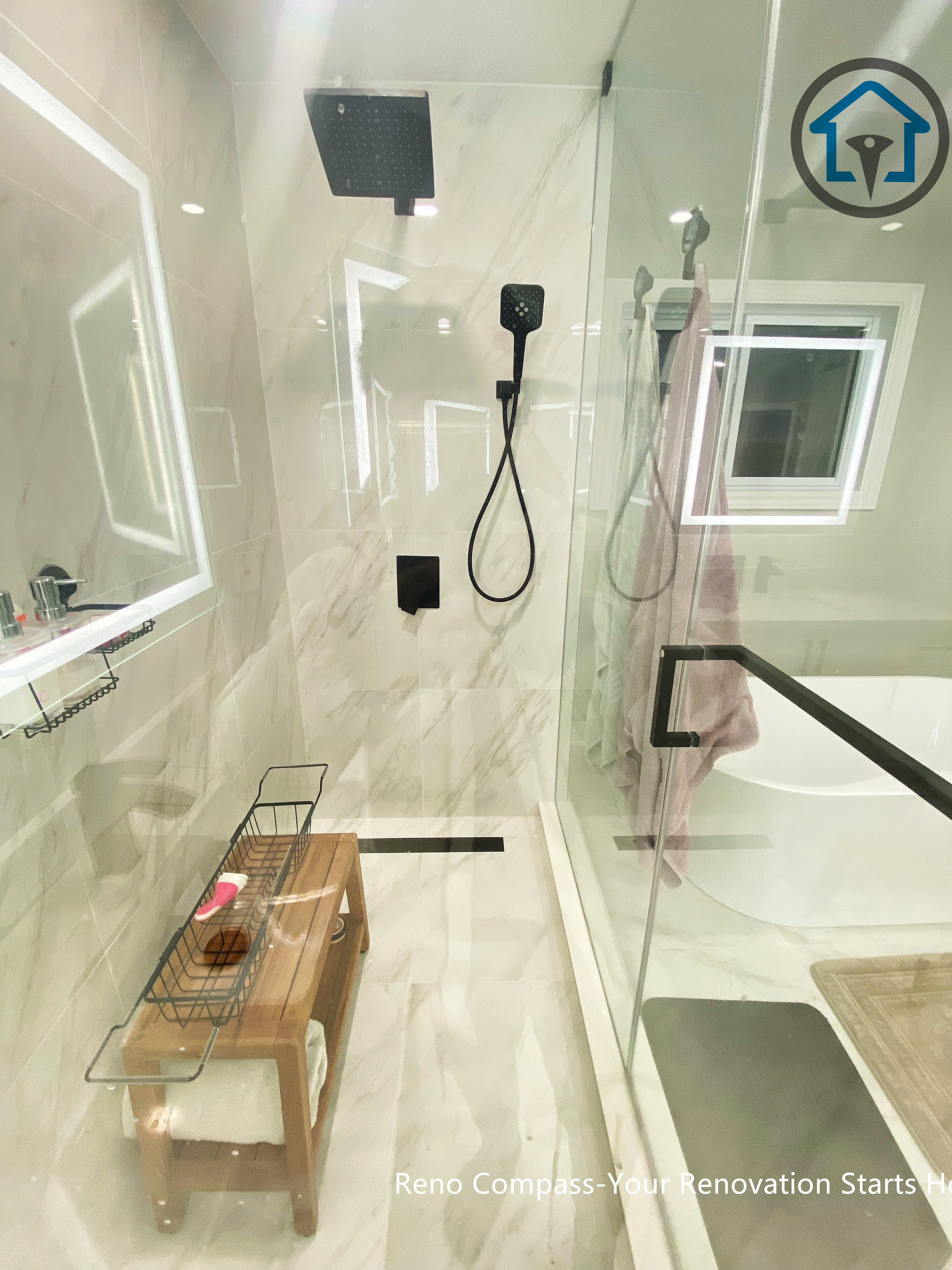 Interior view of the walk-in shower featuring Olympia Tile, light neutral finishes, and a clean, open layout that enhances brightness and comfort.