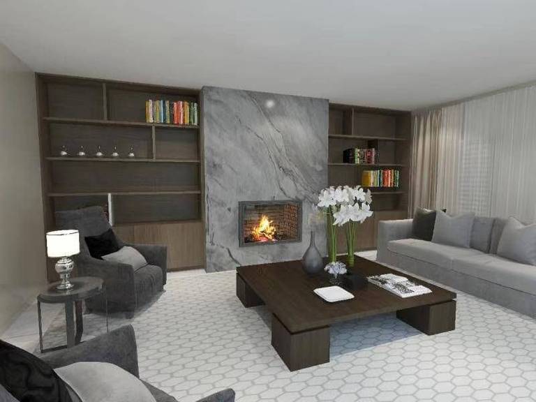 This Toronto interior design project showcases a sophisticated living room featuring a custom marble fireplace feature wall with integrated built-in shelving. The floor-to-ceiling cabinetry enhances storage while maintaining a clean, symmetrical layout. Warm fireplace lighting contrasts beautifully with the neutral-toned furniture and textured area rug, creating a refined yet inviting atmosphere. Designed and executed by Reno Compass Inc., this project reflects modern elegance, functional design, and high-end interior detailing.