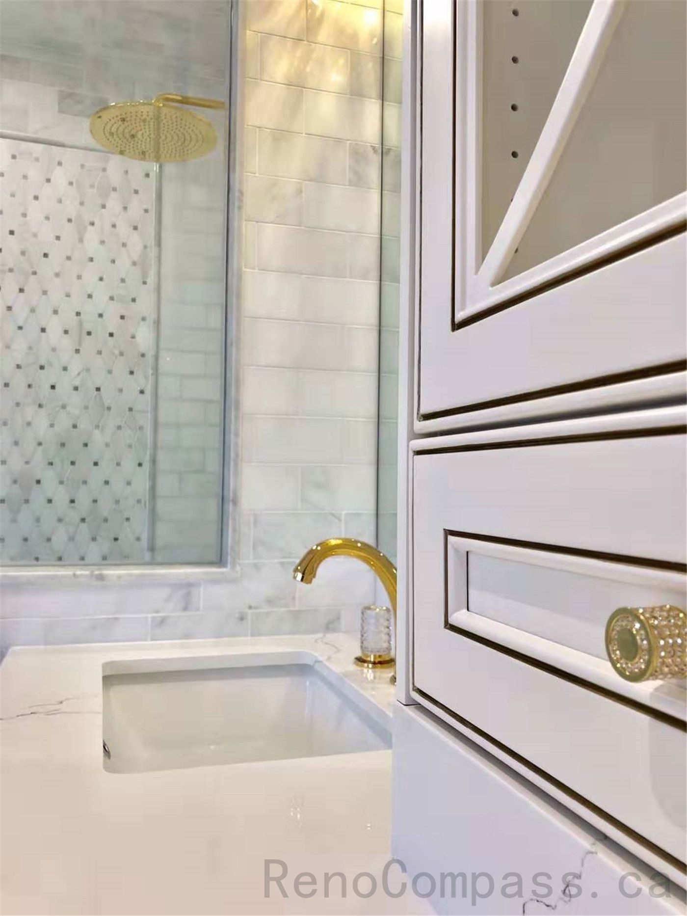 This North York bathroom renovation highlights custom vanity details, featuring a quartz countertop, integrated sink, decorative cabinet fronts, and elegant gold faucet finishes. The close-up view emphasizes craftsmanship, material quality, and refined detailing that elevate the overall bathroom design.