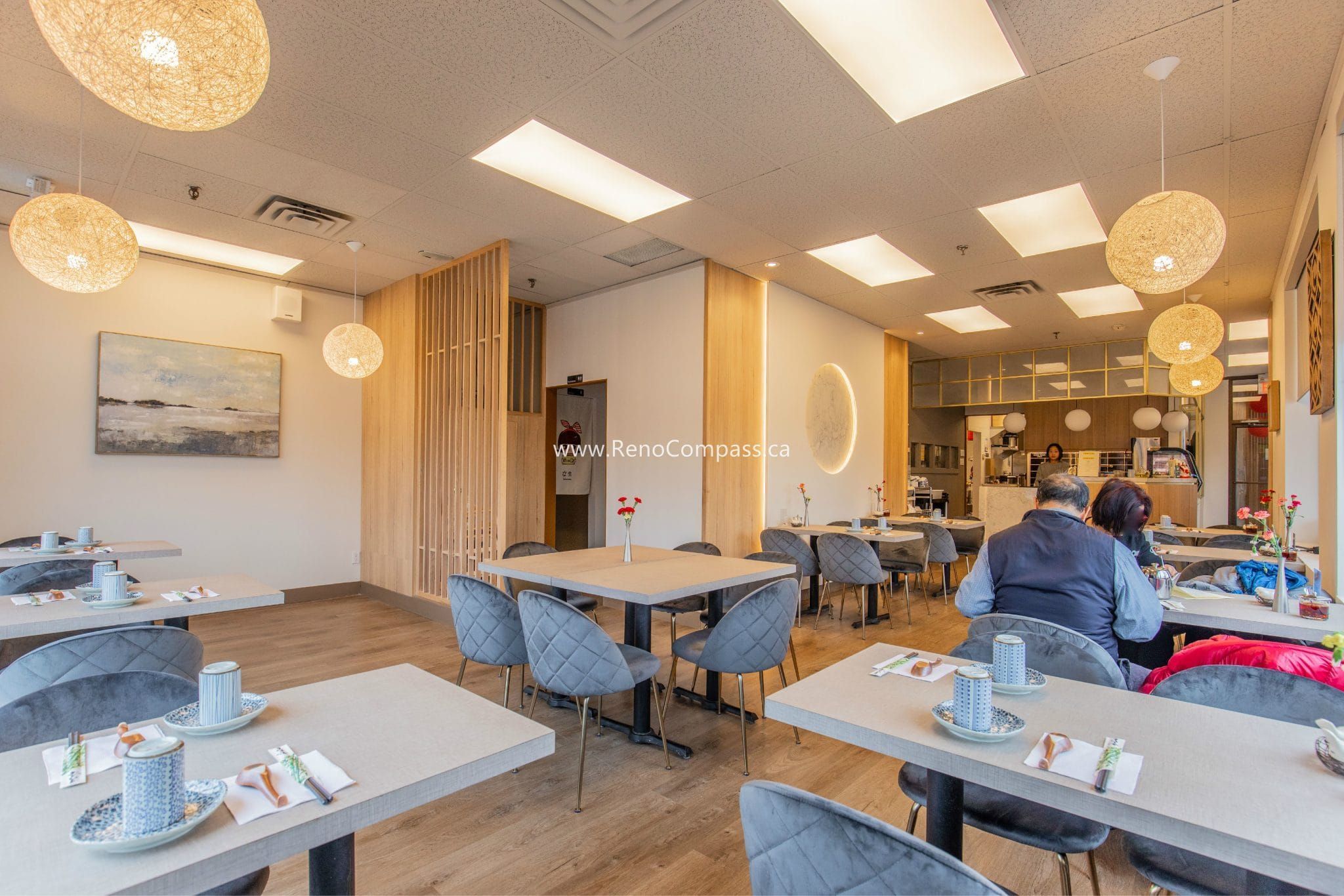 This Richmond Hill Chinese restaurant renovation completed by Toronto renovation company Reno Compass Inc. showcases a bright and modern dining space designed for comfort and efficiency. The upgraded interior features warm wood flooring, custom wall finishes, elegant pendant lighting, and contemporary seating arrangements that enhance the overall dining experience. With a carefully planned layout and refined aesthetic details, the renovation creates a welcoming atmosphere for guests while improving functionality and flow for daily restaurant operations.