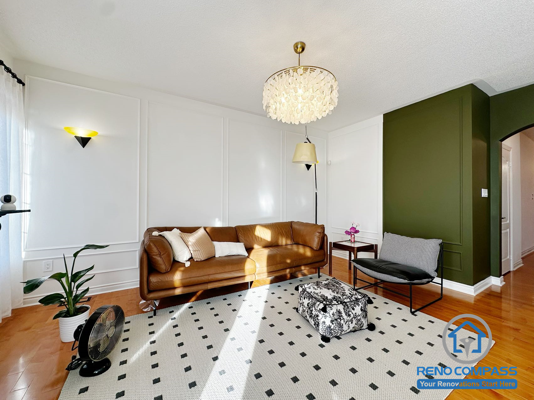 Living room from a completed interior renovation project in Markham, featuring a clean layout and a comfortable gathering space by Reno Compass.