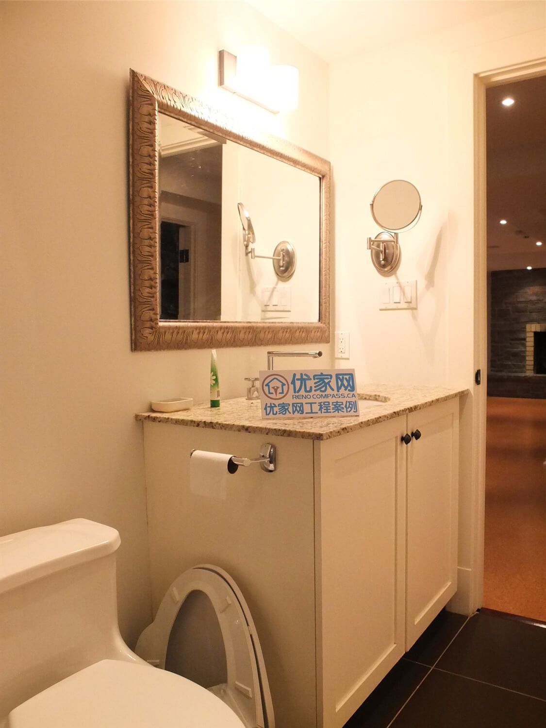 This Oakville basement bathroom renovation features a clean and elegant vanity area with a granite countertop, classic framed mirror, and white cabinetry. Warm lighting and carefully selected fixtures create a comfortable and refined bathroom environment. Completed by a professional Toronto Renovation Company, the project highlights quality materials, precise installation, and a timeless bathroom design suitable for modern Oakville homes.