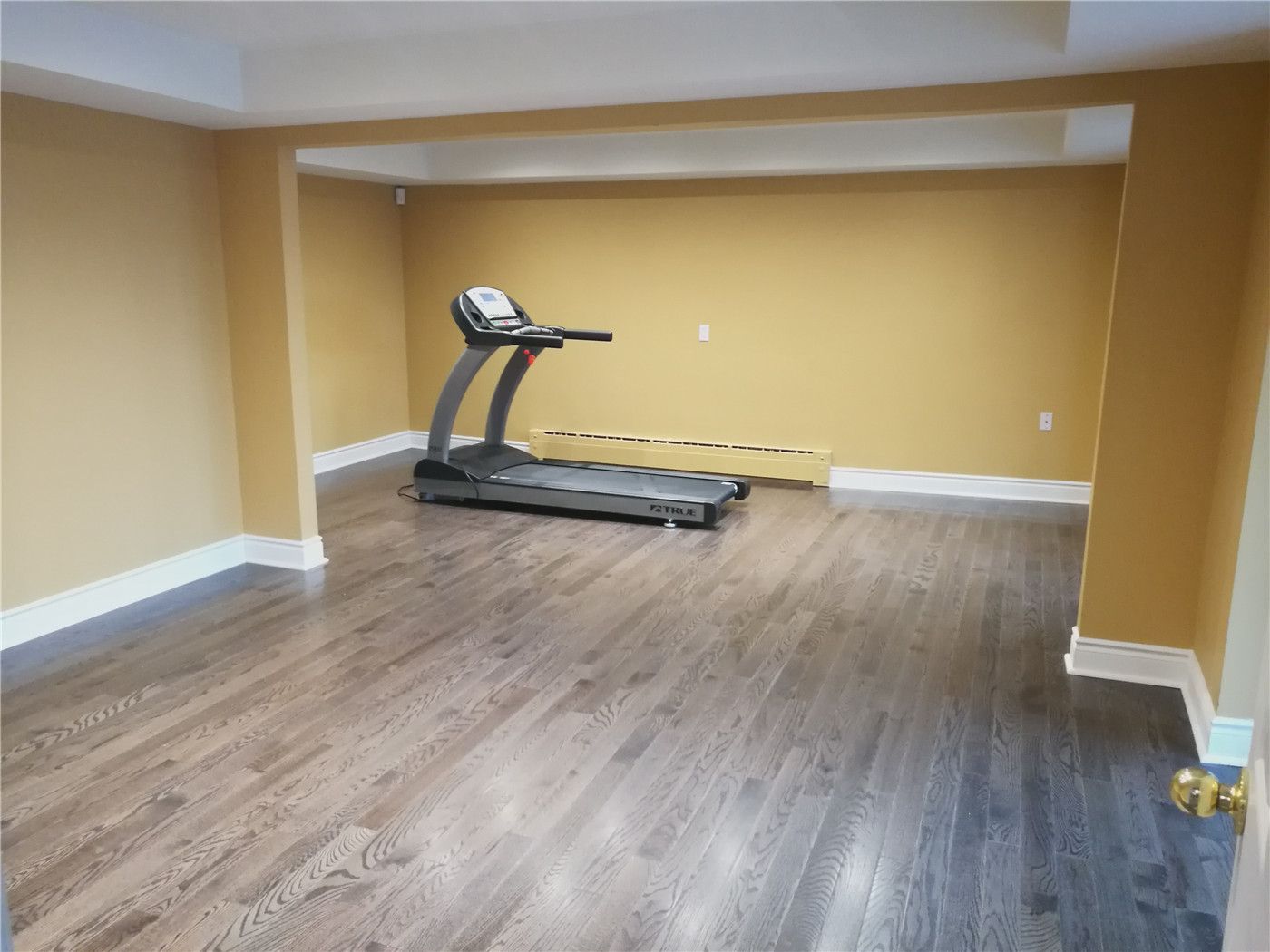 This detached home flooring renovation in Mississauga features newly installed wood flooring that enhances both durability and visual warmth. The upgraded floor creates a clean and modern foundation for the space, complemented by fresh wall finishes and improved lighting. The installation focuses on precision leveling, seamless transitions, and long-lasting performance suitable for everyday family living. Completed by an experienced Toronto renovation company, this project highlights professional craftsmanship, practical design, and high-quality flooring solutions for detached homes across the GTA.
