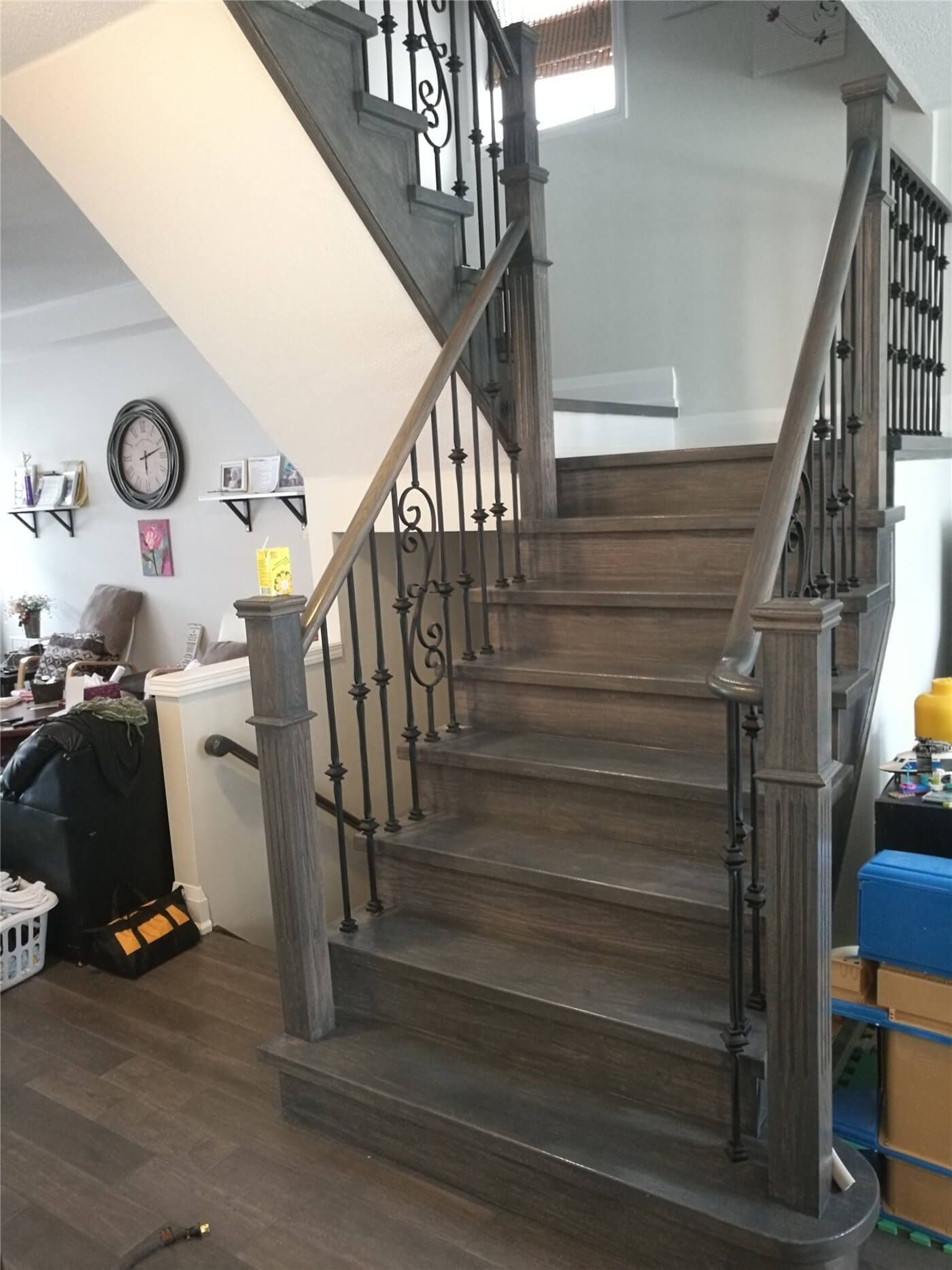 This Markham basement renovation features newly installed dark hardwood flooring and a refreshed staircase area, creating a clean, modern, and durable lower-level living space. Completed by Reno Compass Inc., the project enhances both functionality and visual appeal for everyday comfort.