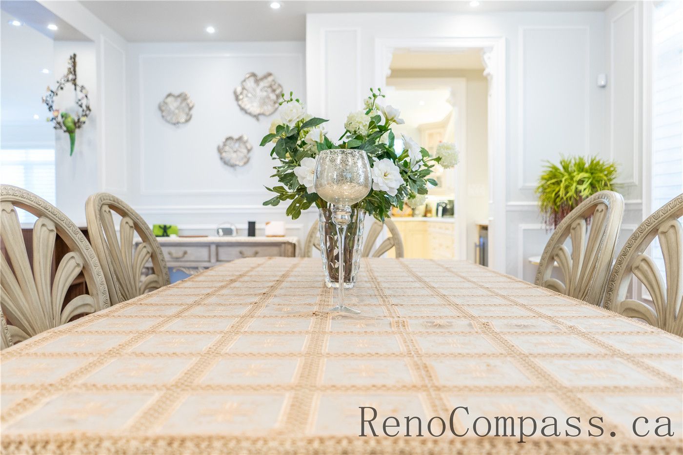 This Richmond Hill dining room renovation features an elegant open-concept layout with custom wall paneling, modern lighting, and seamless flow into the kitchen and living areas. The refined finishes and cohesive design enhance everyday comfort and entertaining, showcasing the craftsmanship of a trusted Toronto renovation company specializing in full house interior renovations.