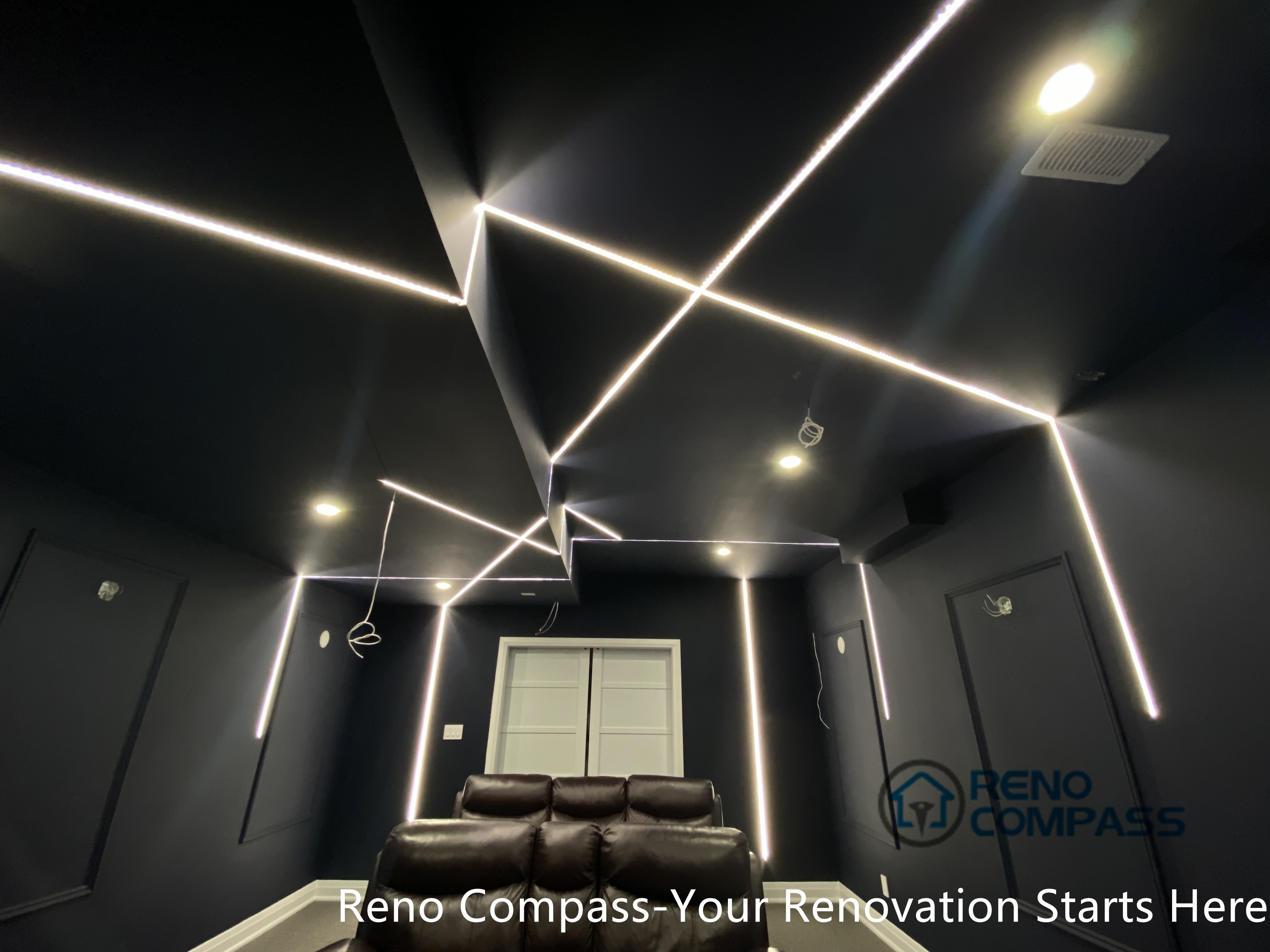 This Newmarket basement home theater renovation features a modern dark-tone design with custom recessed LED ceiling lighting, acoustic wall panels, and a dedicated media seating layout. Designed and built by an experienced Toronto renovation company, this basement transformation delivers a cinematic atmosphere while maintaining comfort, clean lines, and functional lighting control—ideal for family entertainment and private movie nights.