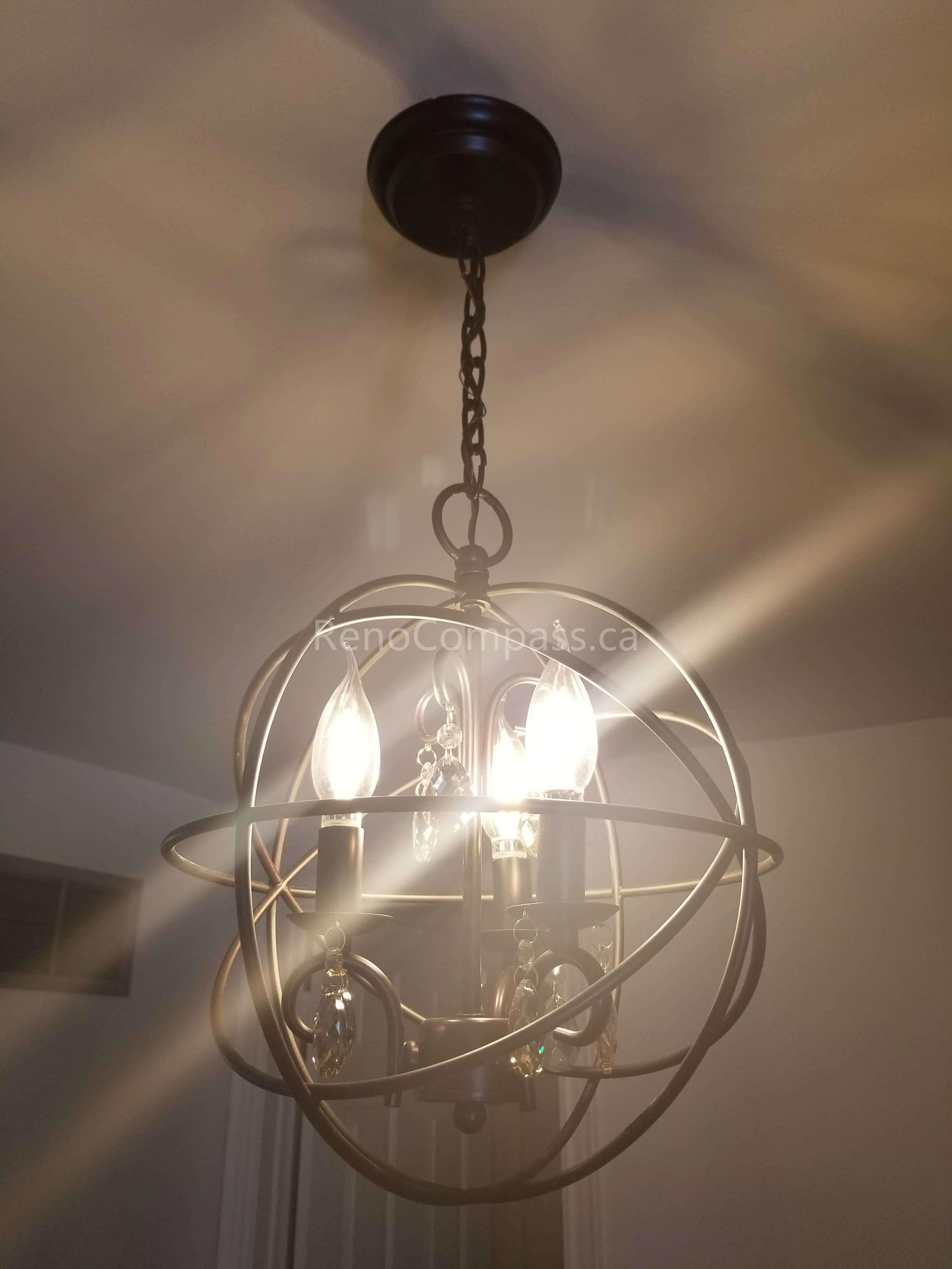 This Mississauga interior renovation highlights a stylish modern chandelier installation that enhances the home’s ambiance with warm lighting and contemporary design. The decorative ceiling light fixture adds elegance and character, serving as a focal point that elevates the overall interior atmosphere.

Installed by Reno Compass Inc., this lighting upgrade combines functionality and aesthetic appeal, bringing a sophisticated and welcoming touch to the renovated living space.