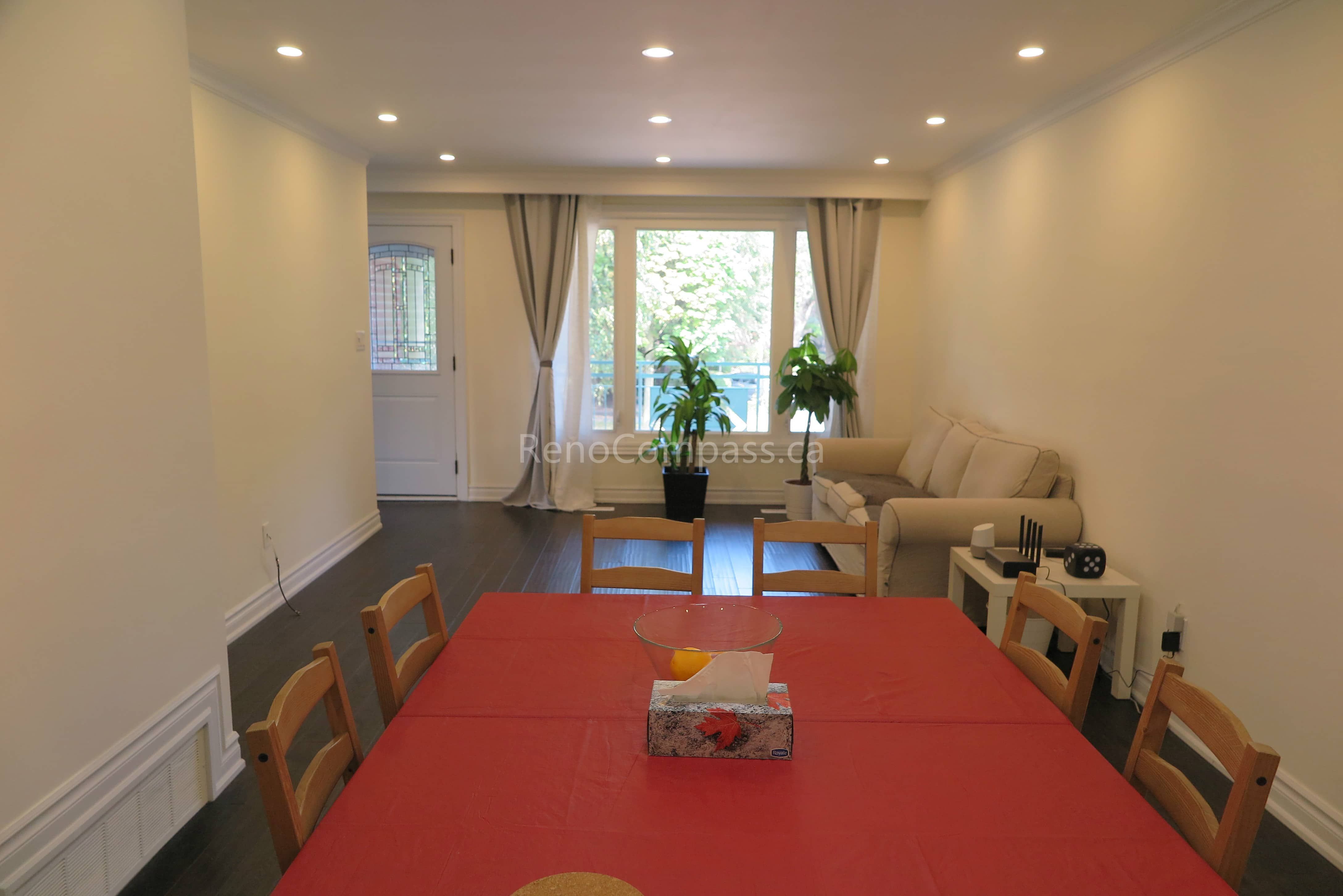This North York interior renovation showcases a bright and modern open-concept living and dining space with newly installed hardwood flooring and recessed pot lights. The clean wall finishes, upgraded lighting, and spacious layout create a warm and inviting atmosphere perfect for everyday living and family gatherings. Completed by Reno Compass Inc., this renovation enhances comfort, functionality, and modern home value through quality craftsmanship and thoughtful design.