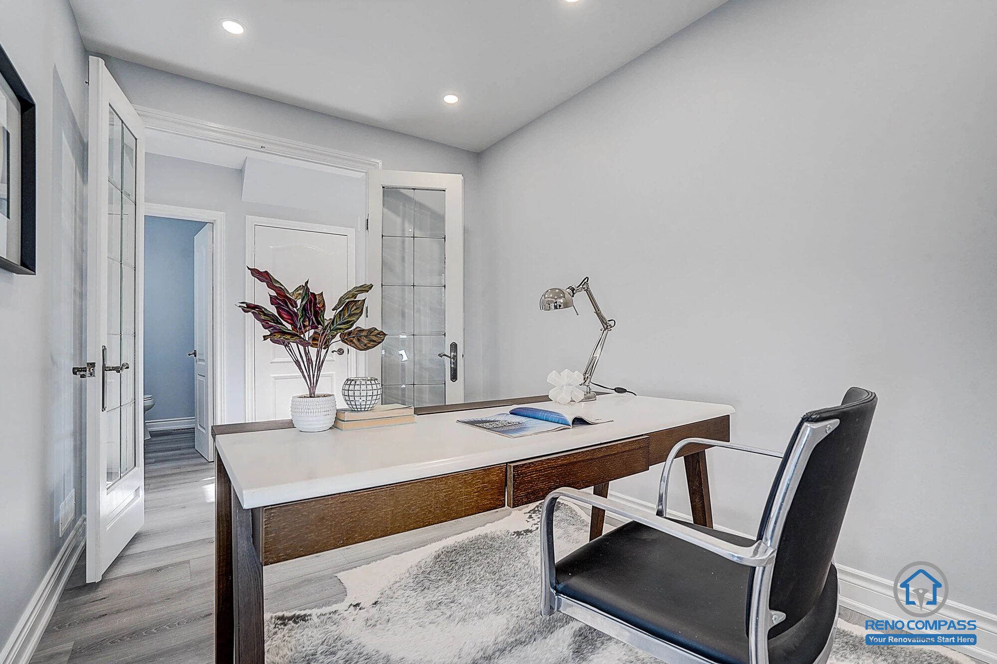 Home office renovation in Vaughan featuring new flooring, pot lights installation, and clean wall painting for a bright and functional workspace.