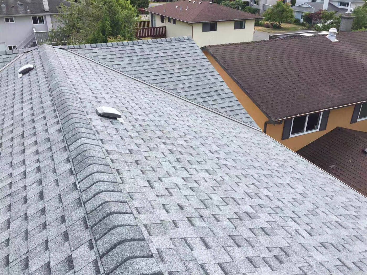 This image showcases the completed stage of a residential roofing replacement project in Toronto, featuring newly installed asphalt shingles with clean alignment and consistent finishing. The roofing system has been carefully installed to ensure proper ventilation, waterproof protection, and long-term durability against Toronto’s seasonal weather conditions. Attention to detail in shingle layout, ridge finishing, and overall roof slope enhances both structural performance and exterior curb appeal. Completed by a professional Toronto roofing and renovation team, this new roof installation provides improved energy efficiency, reliable protection, and a refreshed exterior look for the home.
