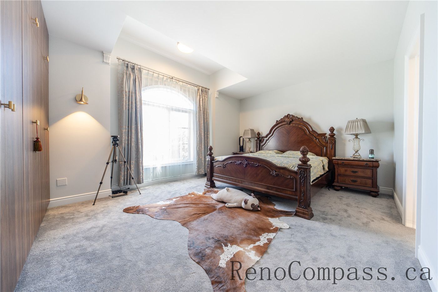 This Richmond Hill entire house interior renovation features a spacious master bedroom with soft carpeting, elegant lighting, and large windows that bring in natural light. Custom wardrobe storage and refined finishes create a comfortable and luxurious private retreat. Completed by a professional Toronto renovation company, this bedroom renovation enhances functionality, comfort, and timeless interior design for modern family living.
