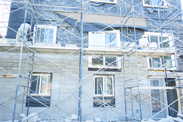 Professional exterior wall remodeling project in Richmond Hill showcasing a refreshed brick façade using high-quality finishes.