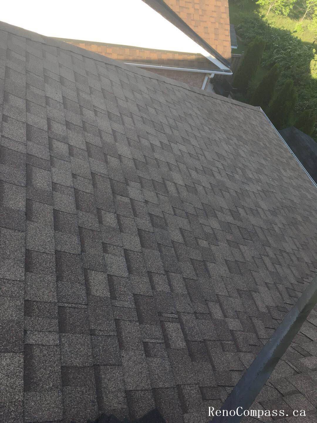 This image showcases the completed stage of a residential roofing replacement project in Toronto, featuring newly installed asphalt shingles with clean alignment and consistent finishing. The roofing system has been carefully installed to ensure proper ventilation, waterproof protection, and long-term durability against Toronto’s seasonal weather conditions. Attention to detail in shingle layout, ridge finishing, and overall roof slope enhances both structural performance and exterior curb appeal. Completed by a professional Toronto roofing and renovation team, this new roof installation provides improved energy efficiency, reliable protection, and a refreshed exterior look for the home.